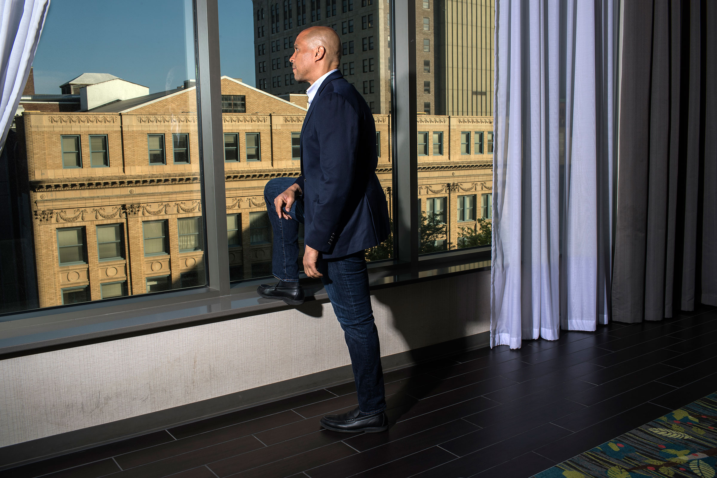 Booker stands for a portrait in downtown Cedar Rapids, Iowa on June 8. (Danny Wilcox Frazier—VII for TIME)