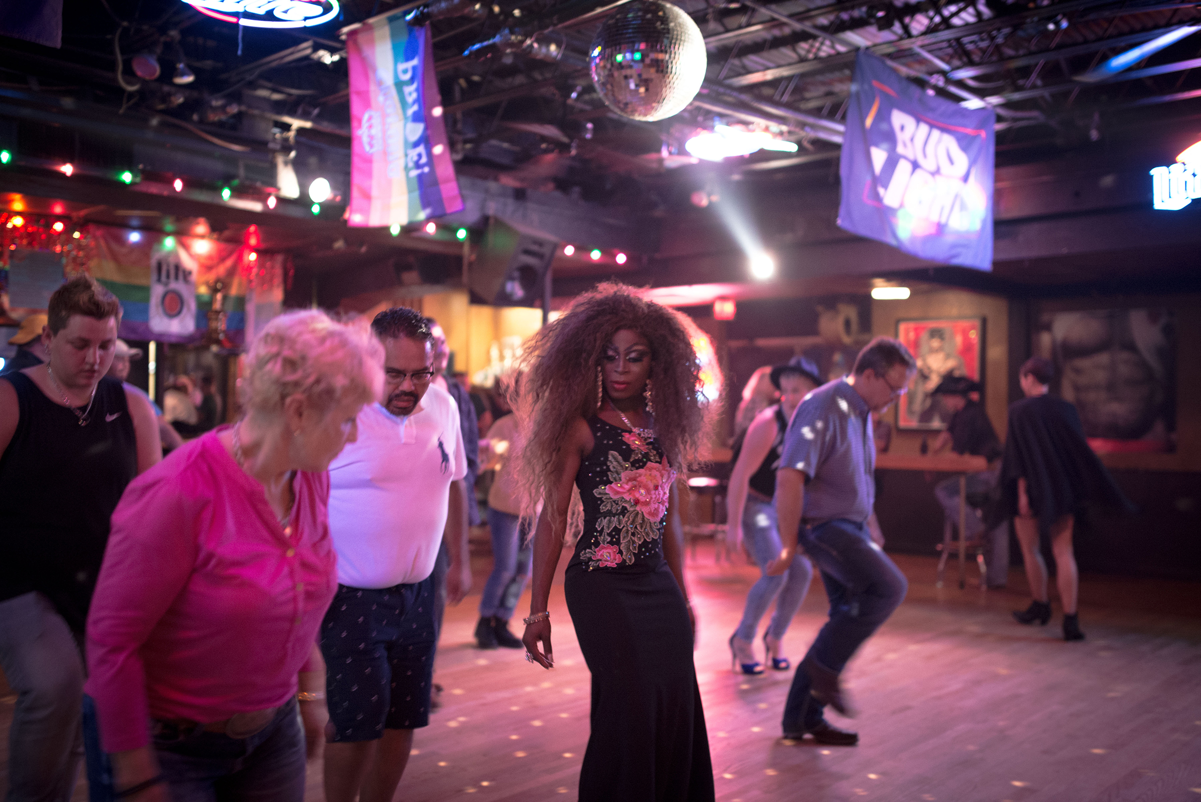 Adoniis Gabrielle, center, line dances at the Finishline in Oklahoma City. (September Dawn Bottoms for TIME)