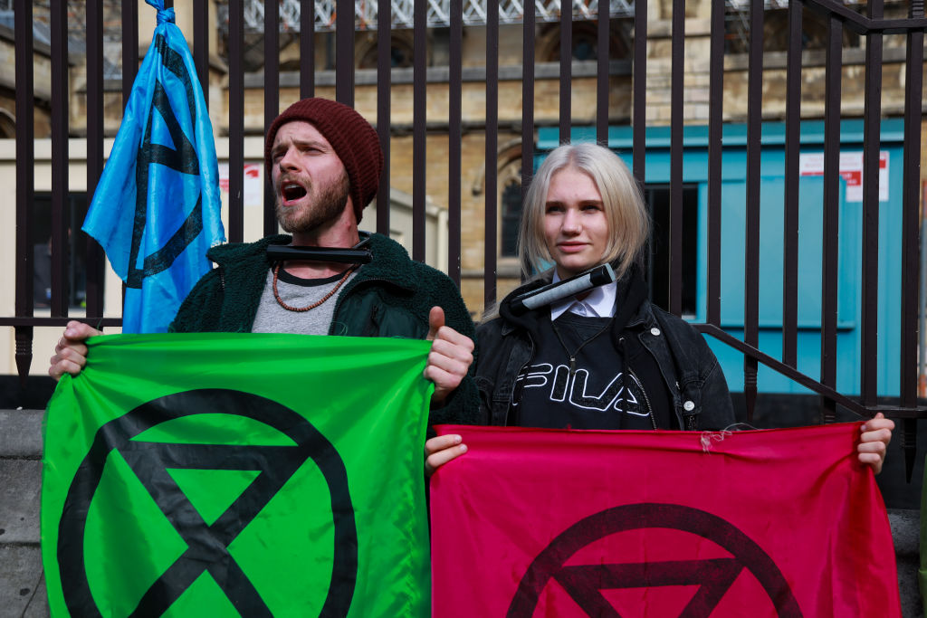 Members of the Extinction Rebellion Youth group locked themselves to the fence of Parliament demanding climate change action on May 3rd 2019 in London, United Kingdom. (Kristian Buus—In Pictures via Getty Images)