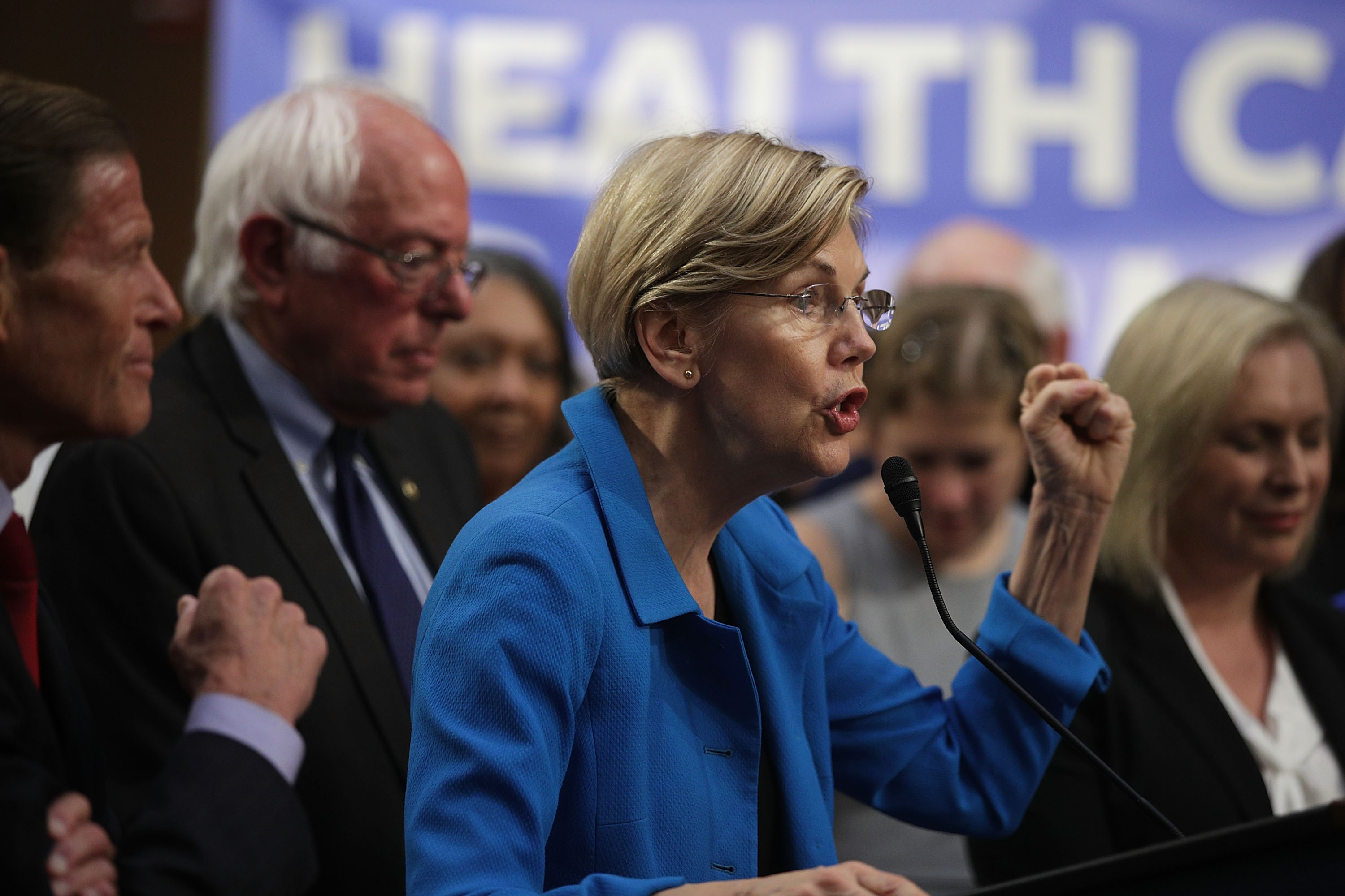 U.S. Sen. Elizabeth Warren (D-MA) (C) speaks on health care as Sen. Bernie Sanders (I-VT) (2nd L) listens during an event September 13, 2017 on Capitol Hill in Washington, DC (Alex Wong—Getty Images)
