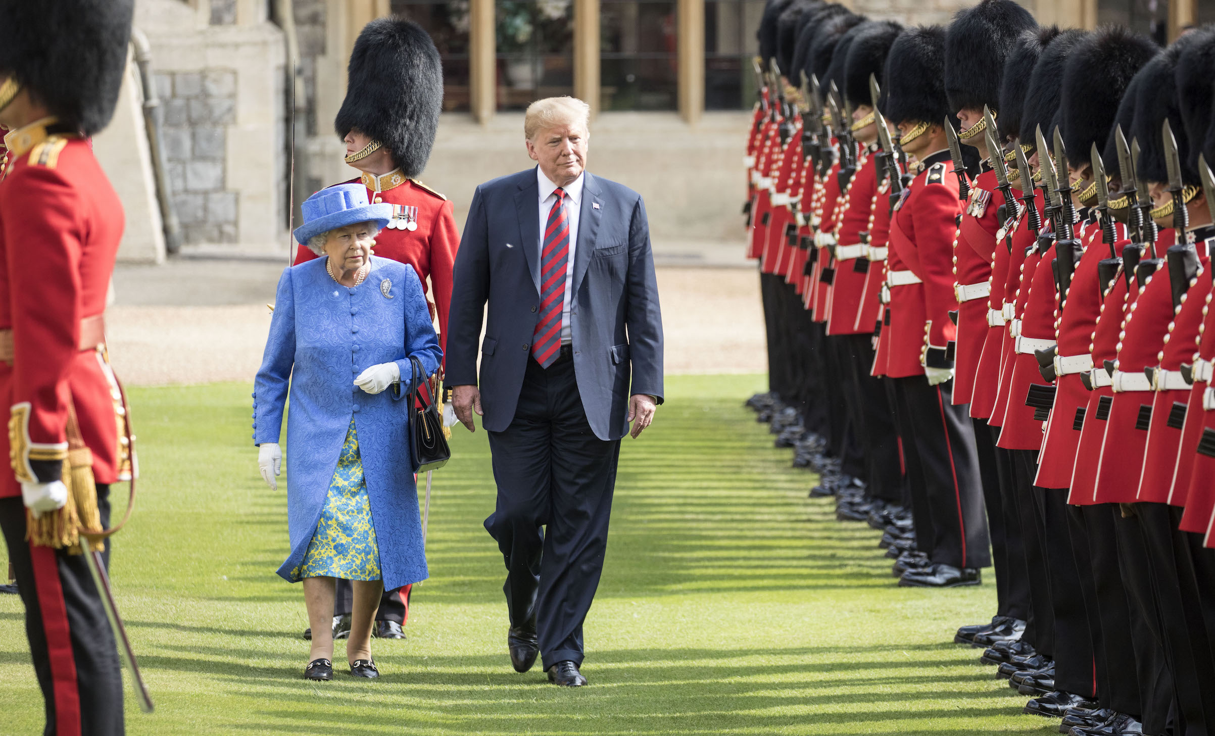 The Queen walks with President Trump as they inspect the Coldstream guards at Windsor castle on July 13, 2018. (Times Photographer Richard Pohle—Getty Images)