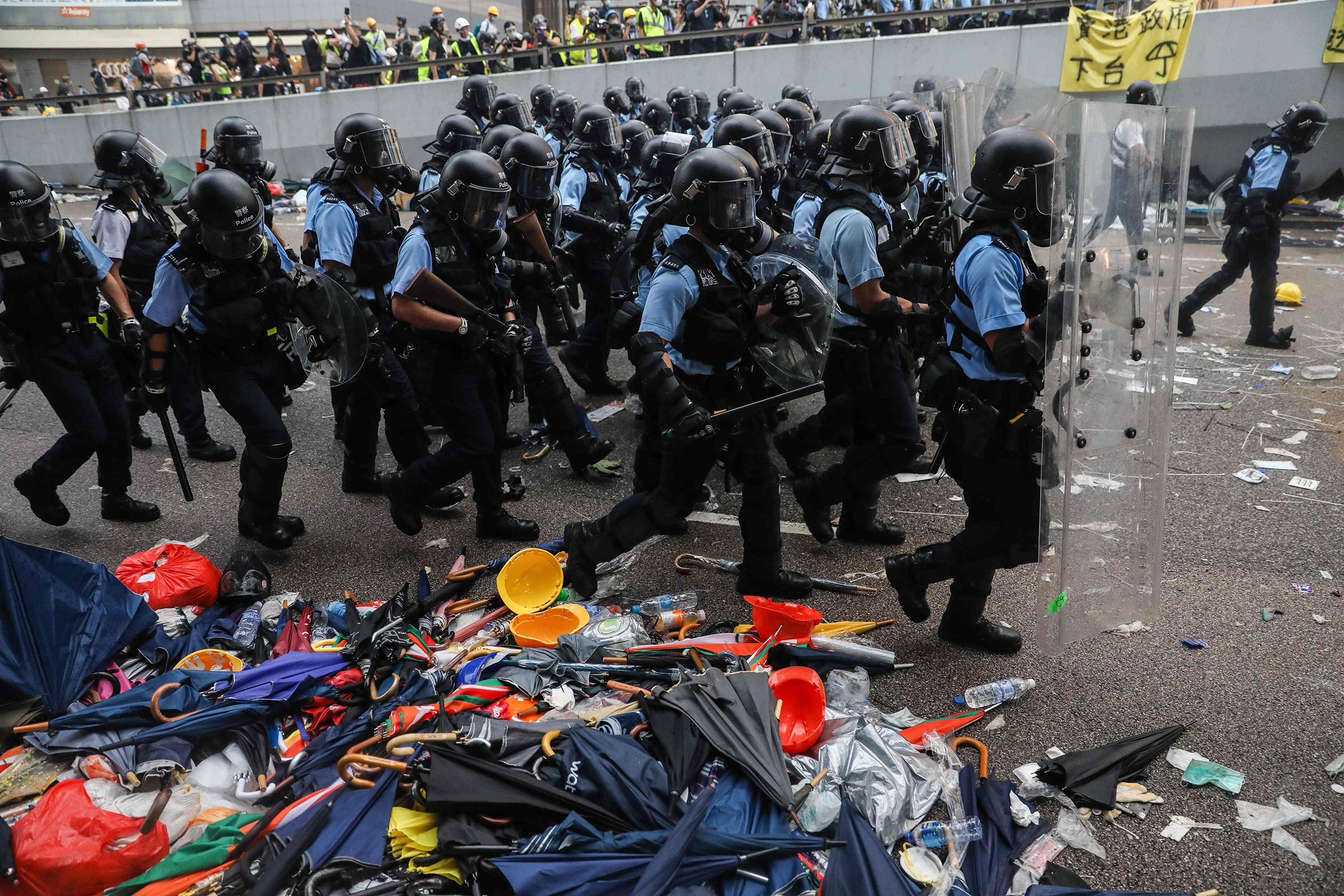 Police advance towards protesters during a rally against a controversial extradition law proposal outside the government headquarters in Hong Kong on June 12.