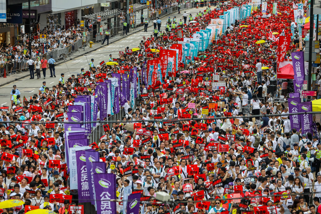 Protesters march during a rally against a controversial extradition law proposal in Hong Kong on June 9, 2019. (Dale de la Rey—AFP/Getty Images)