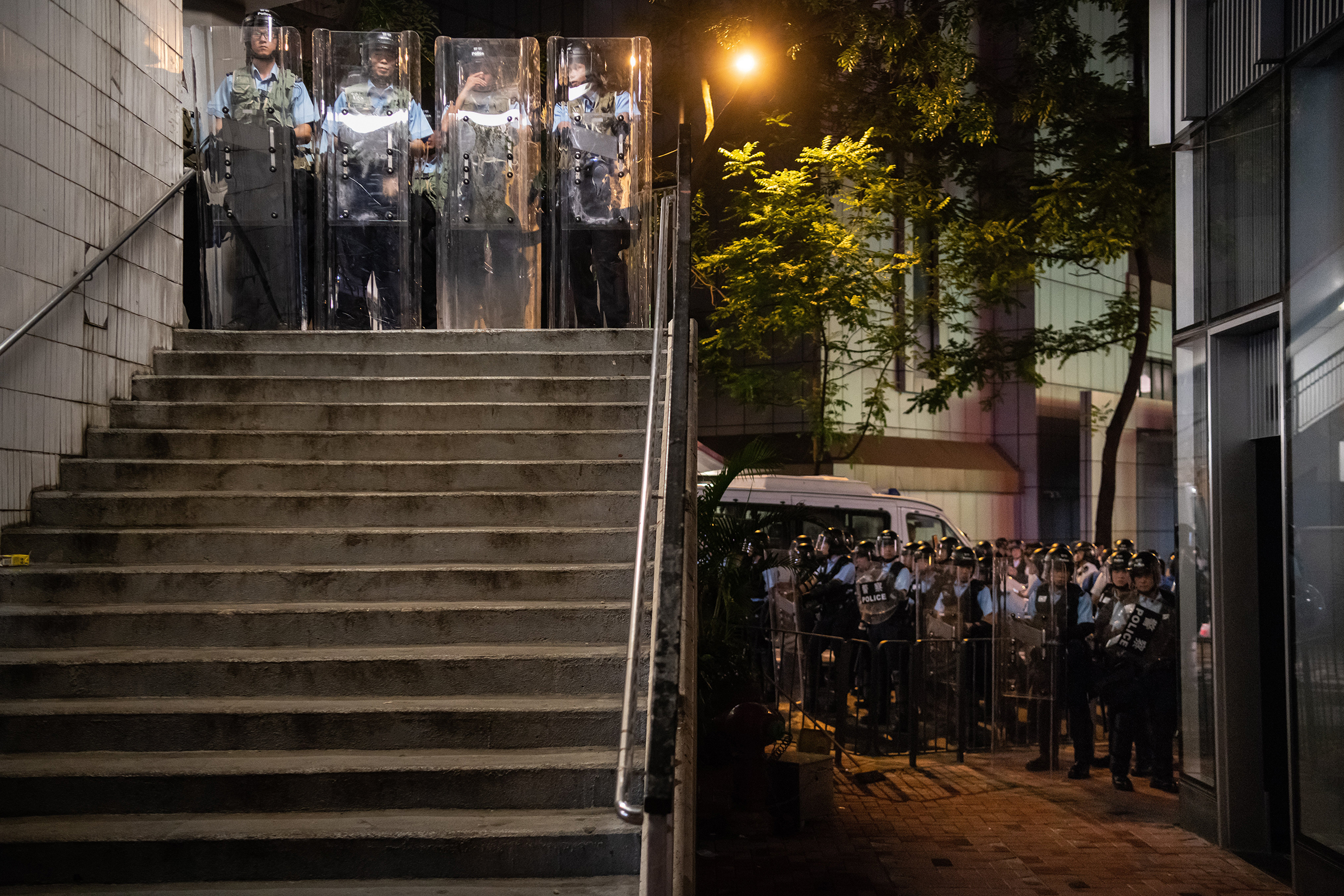 Police officers stand guard during a protest on June 12. (Billy H.C. Kwok—Getty Images)