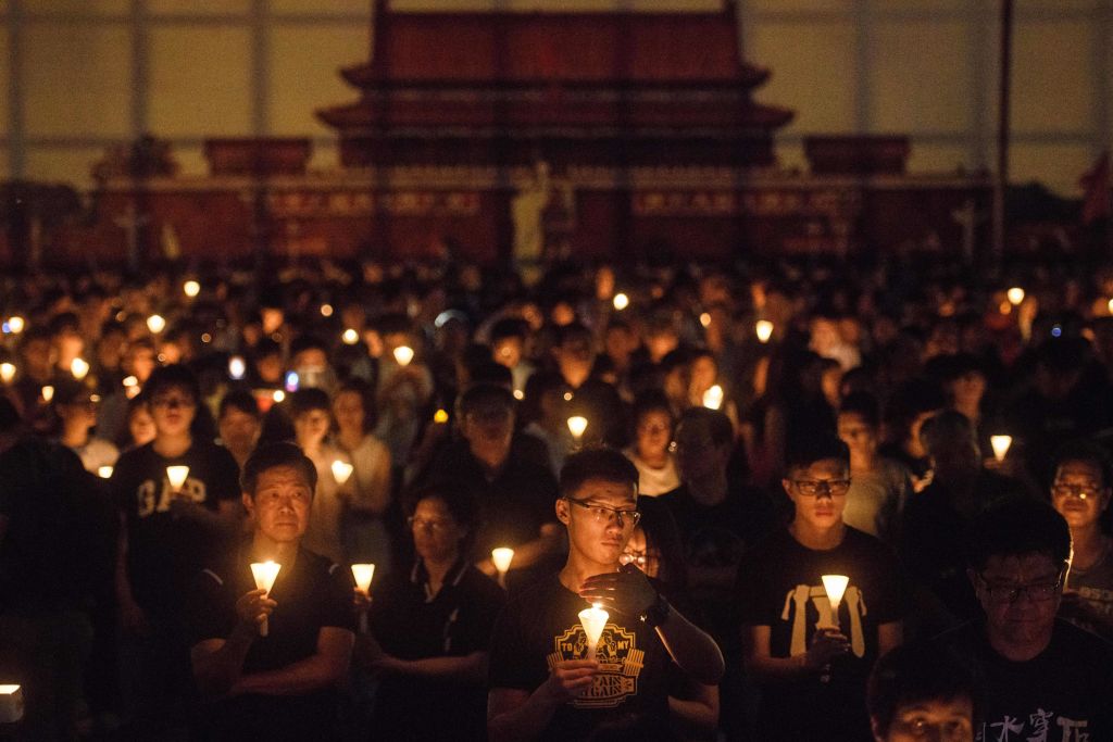 People hold candles during a vigil in Hong Kong on June 4, 2018, to mark the 29th anniversary of the 1989 Tiananmen crackdown in Beijing. (Anthony Wallace—AFP/Getty Images)