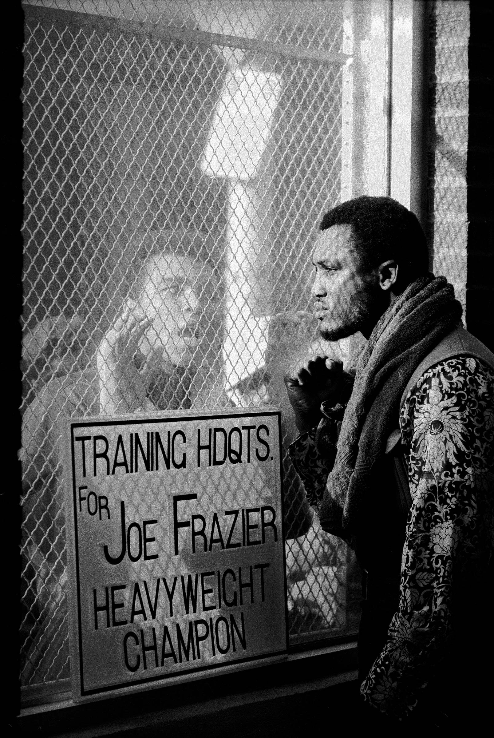 American boxer Muhammad Ali taunts rival boxer Joe Frazier at Frazier's training headquarters in Philadelphia, early 1971. The two men fought for the World Heavyweight Title on March 8—Frazier won.