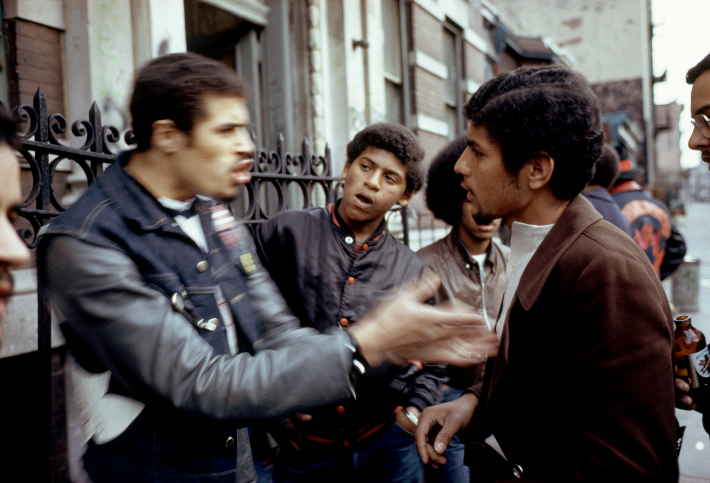 Eddie Cuevas from the gang 'Reapers' discussing with another gang called the 'Javelins' about cleaning up the neighborhood, Bronx, New York, 1972.