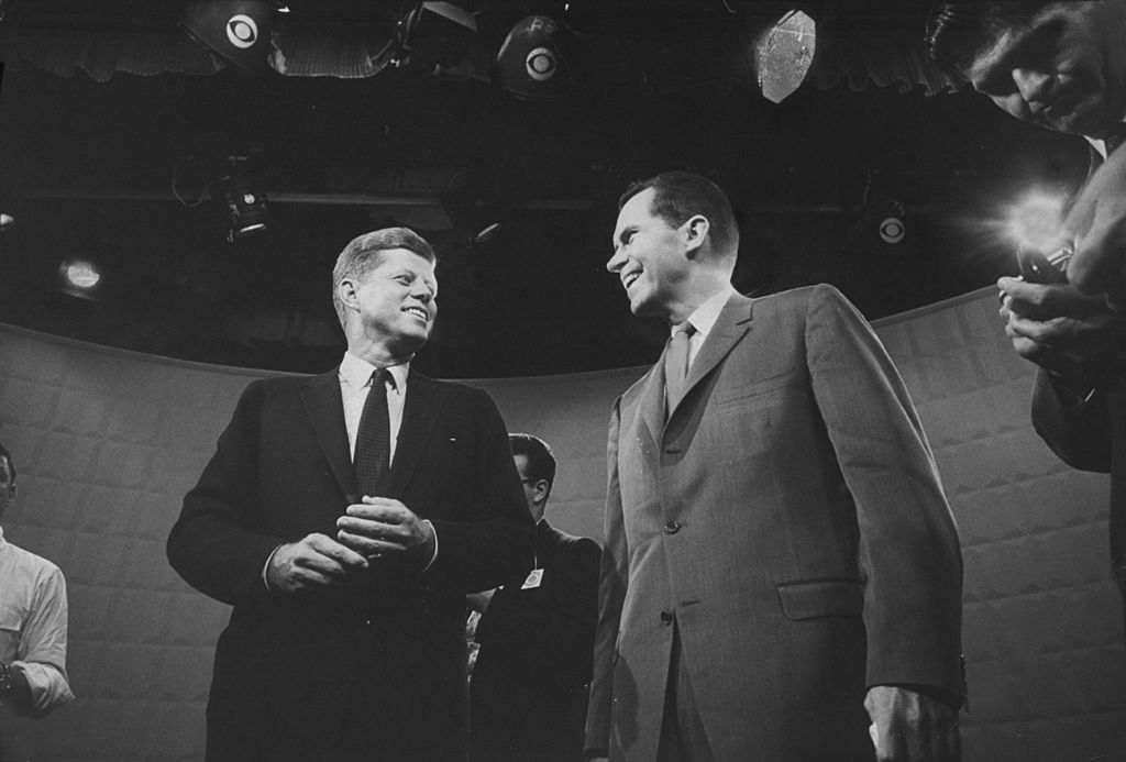 Presidential candidates John F. Kennedy and Richard M. Nixon exchanging smile prior to beginning their 1st TV debate. (Paul Schutzer—The LIFE Picture Collection/Gett)