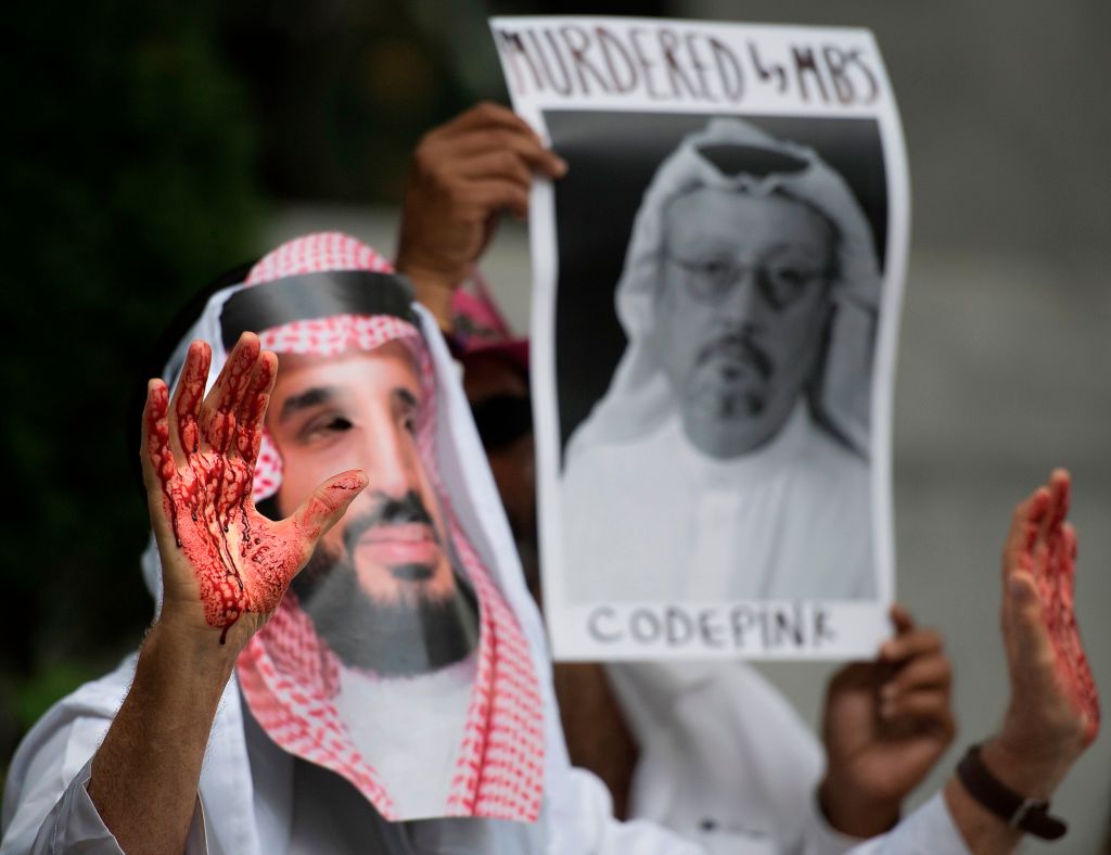 A demonstrator dressed as Saudi Arabian Crown Prince Mohammed bin Salman (C) with blood on his hands protests outside the Saudi Embassy in Washington, DC, on Oct. 8, 2018. (Jim Watson&mdash;AFP/Getty Images)