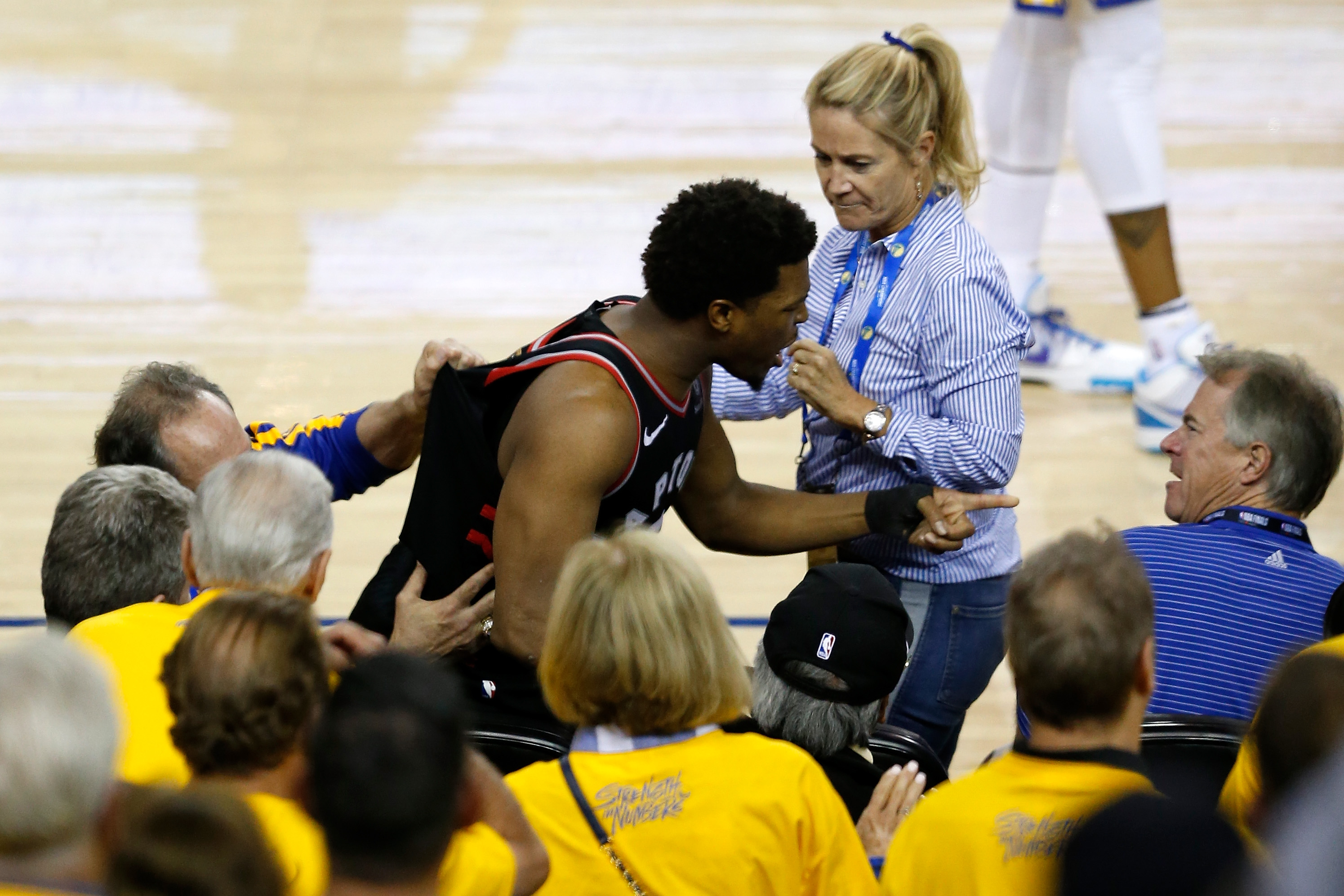 Kyle Lowry #7 of the Toronto Raptors argues with Warriors minority investor Mark Stevens  after Lowry chased down a loose ball in the second half against the Golden State Warriors during Game Three of the 2019 NBA Finals at ORACLE Arena on June 05, 2019 in Oakland, California. (Photo by Lachlan Cunningham/Getty Images) (Lachlan Cunningham&amp;Getty Images)