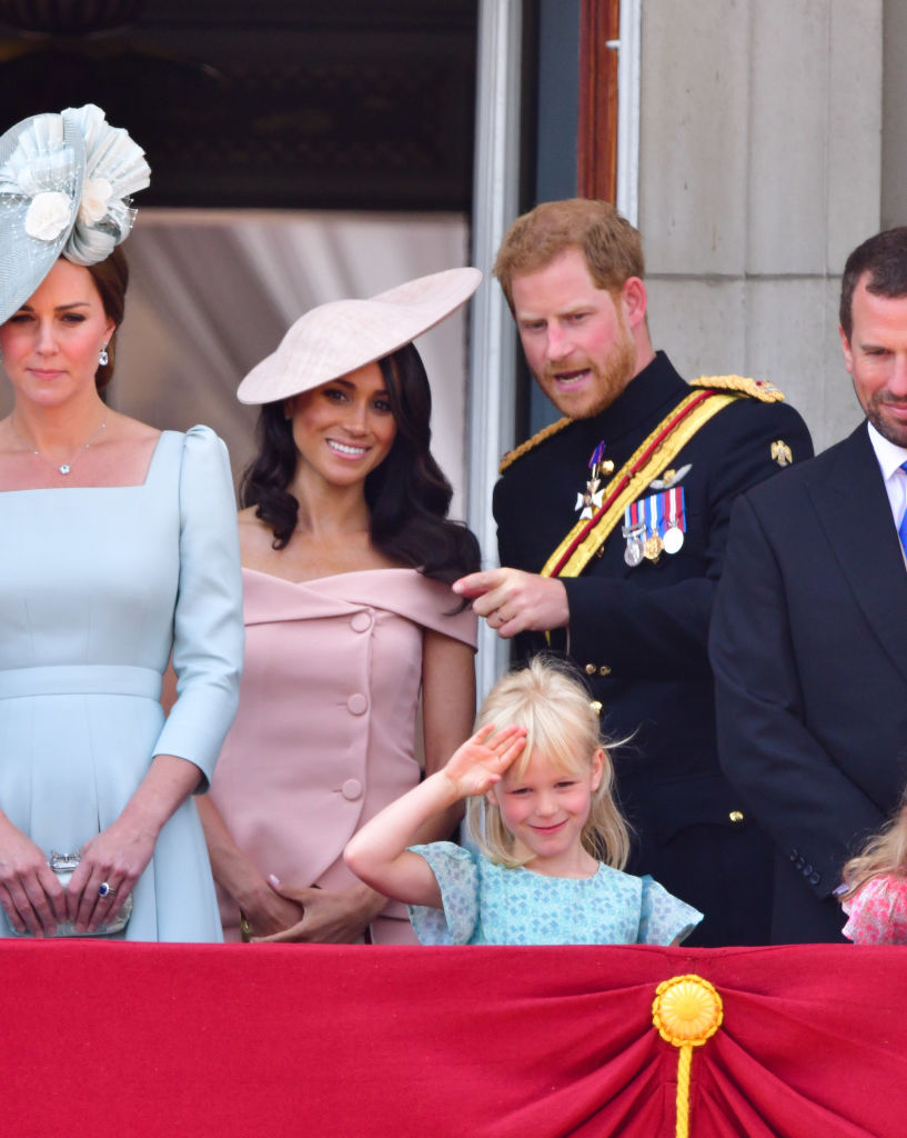 Meghan, Duchess of Sussex and Prince Harry, Duke of Sussex stand on the balcony of Buckingham Palace during the Trooping the Colour parade on June 9, 2018 in London, England. (James Devaney—FilmMagic)