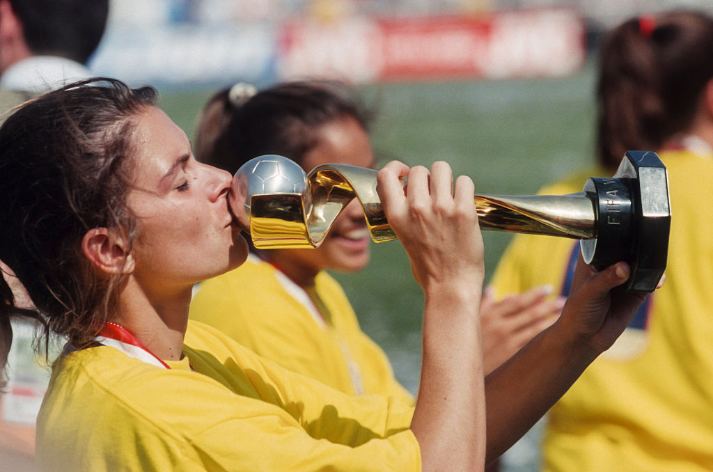Mia Hamm, #9 of the USA, kisses the World Cup Trophy after the 1999 FIFA Women's World Cup final played against China on July 10, 1999 at the Rose Bowl in Pasadena, California. (David Madison—Getty Images)