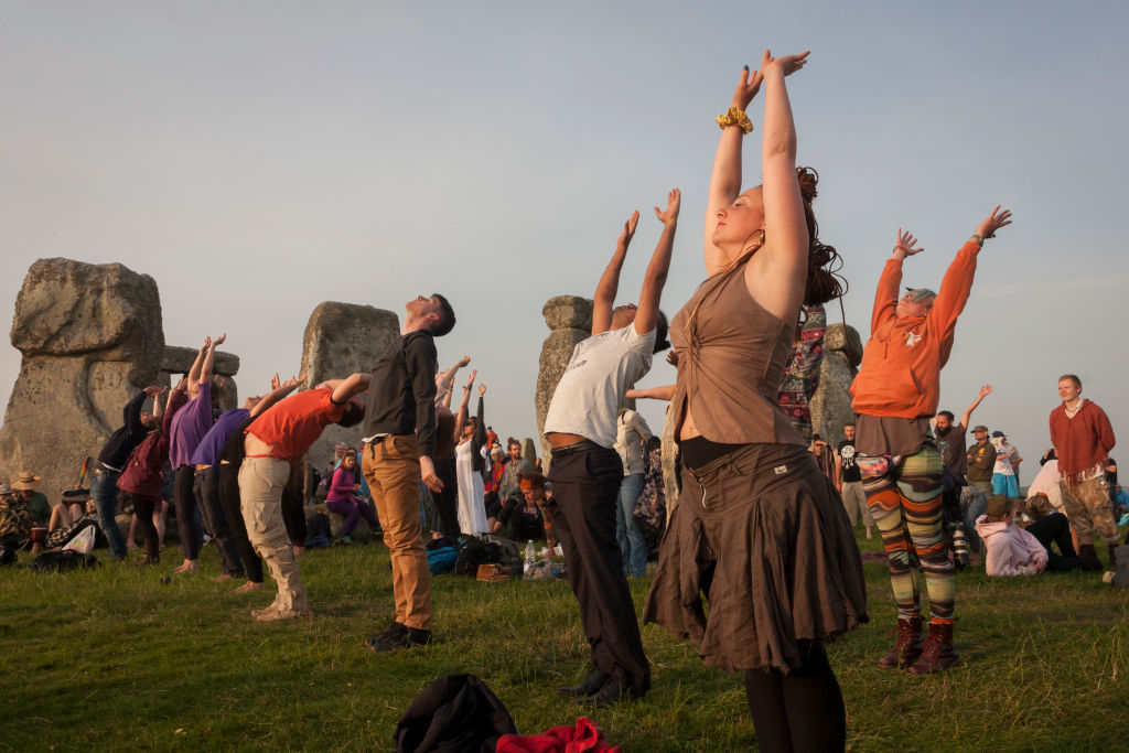 Spiritual revelers celebrate the summer solstice at the ancient stones of Stonehenge, on June 21, 2017, in Wiltshire, England. (Richard Baker—In Pictures/Getty Images)