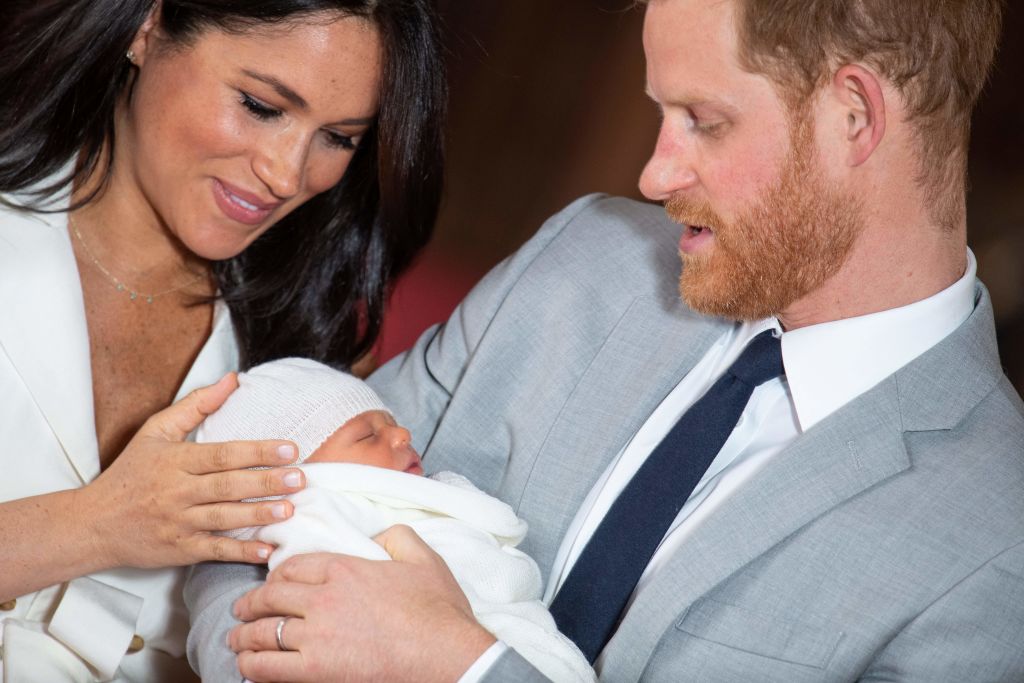 Britain's Prince Harry, Duke of Sussex (R), and his wife Meghan, Duchess of Sussex, pose for a photo with their newborn baby son, Archie Harrison Mountbatten-Windsor, in St George's Hall at Windsor Castle in Windsor, west of London on May 8, 2019. (DOMINIC LIPINSKI&mdash;AFP/Getty Images)