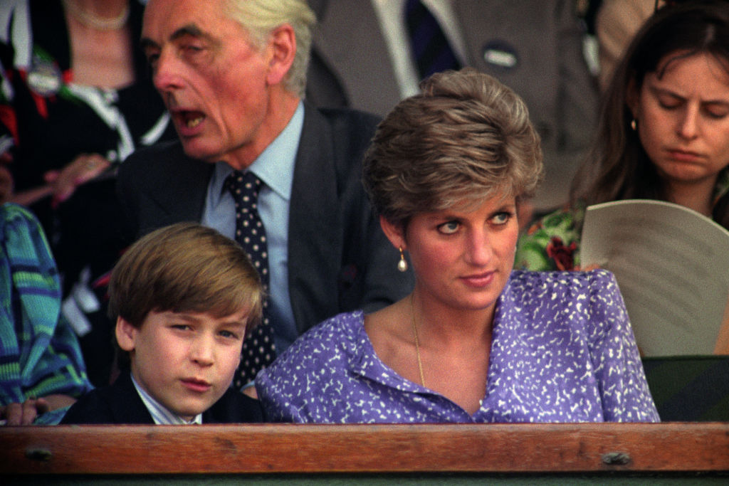 Diana Princess of Wales watches the action from the Royal Box on Centre Court at Wimbledon with her son Prince William. (Rebecca Naden—PA Images/Getty Images)