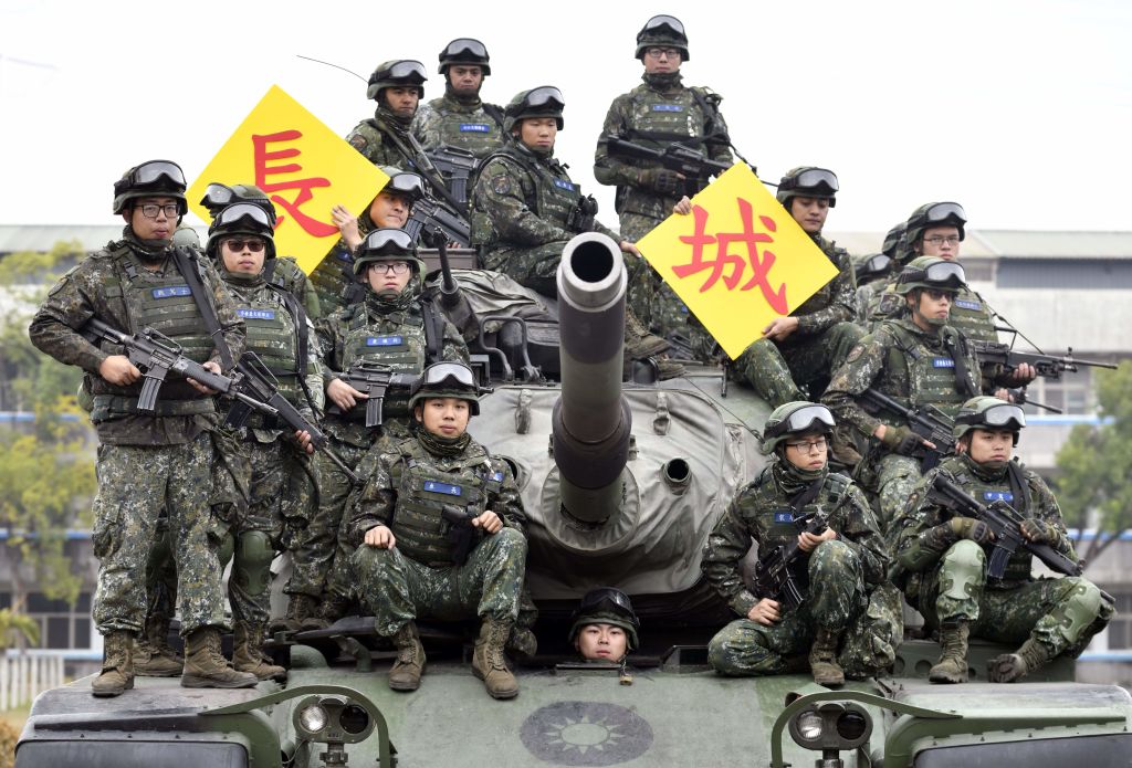 Taiwanese soldiers pose for photos on an US-made M60-A3 tank after an exercise in Taichung, central Taiwan on Jan. 17, 2019. (Sam Yeh&mdash;AFP/Getty Images)