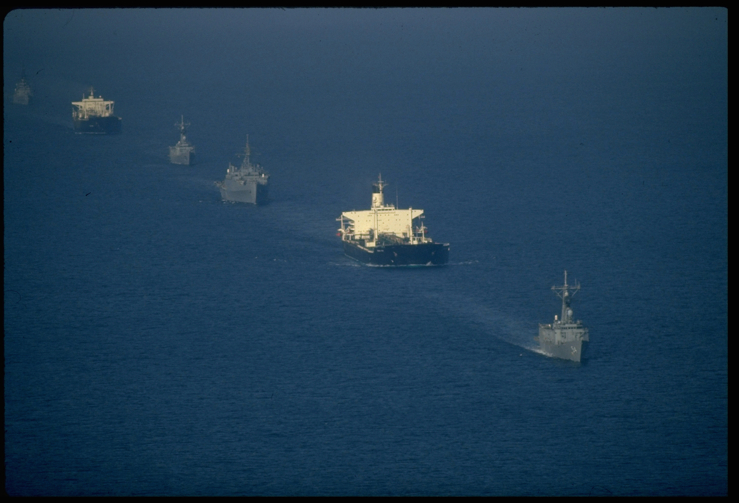 A convoy of US warships escorted re-flagged Kuwaiti oil tankers through Iran-Iraq tanker war plagued waters of Persian Gulf in 1987 (Thomas Hartwell—The LIFE Images Collection via Getty)