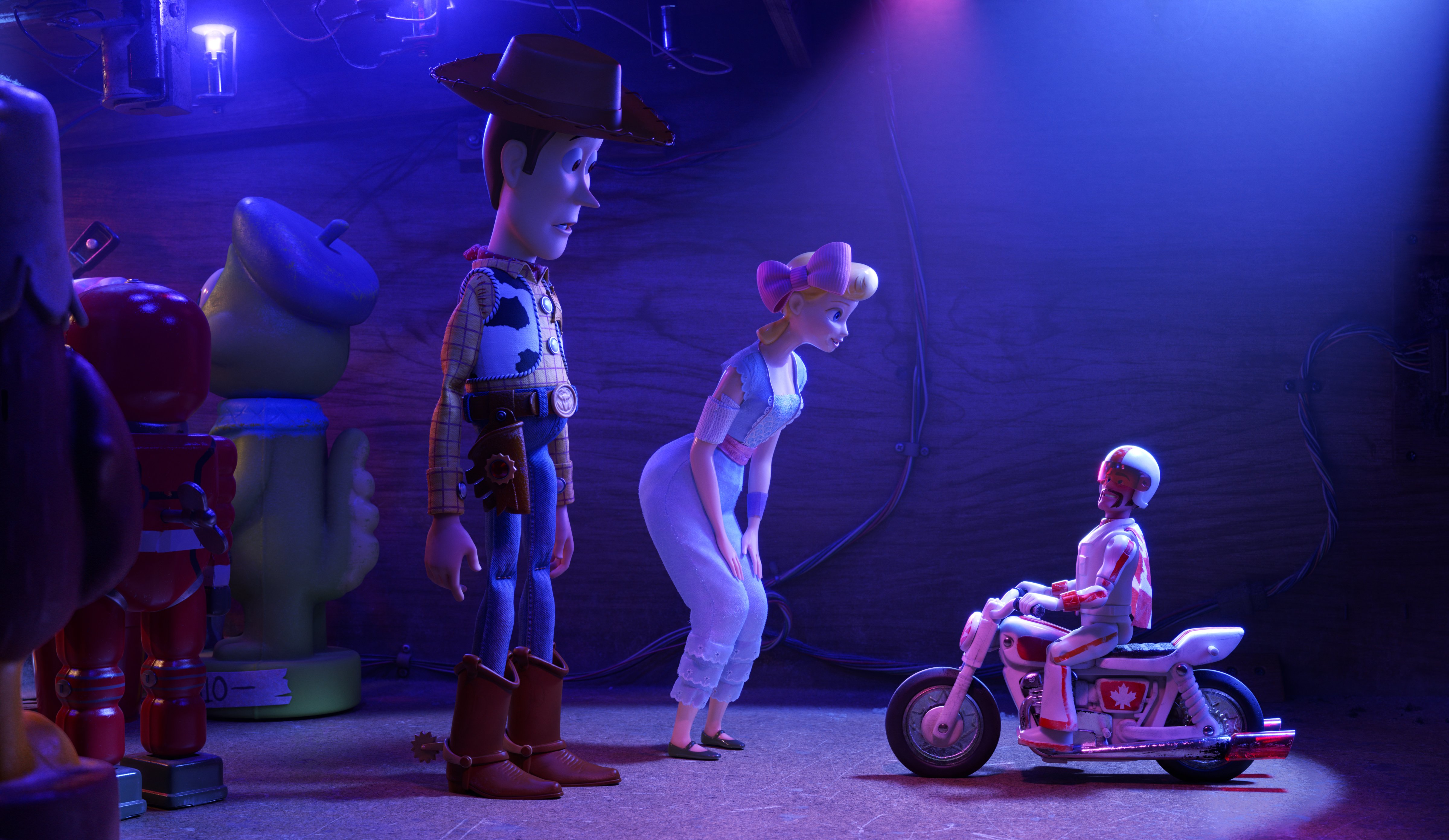 Tom Hanks as the voice of Woody, Annie Potts as the voice of Bo Peep, and Keanu Reeves as the voice of Duke Caboom in <i>Toy Story 4</i> (Disney/Pixar)