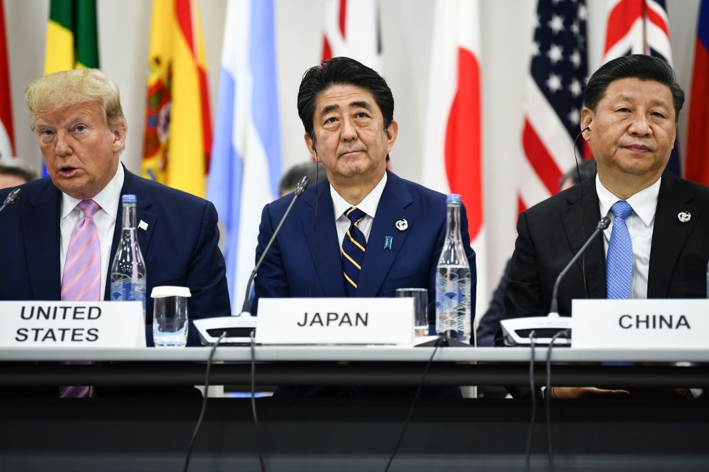 President Donald Trump, Japan's Prime Minister Shinzo Abe and China's President Xi Jinping attend a meeting at the G20 Summit in Osaka on June 28, 2019. (BRENDAN SMIALOWSKI—AFP/Getty Images)