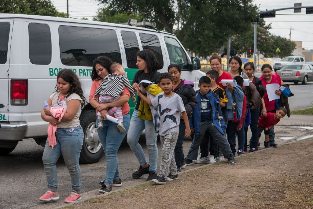Central American migrant families arrive at a Catholic Charities respite center after being released from federal detention on June 12, 2019, in McAllen, Texas. (Loren Elliott—AFP/Getty Images)
