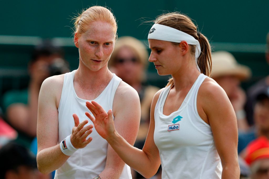 Belgium's Greet Minnen (R) and Belgium's Alison van Uytvanck talk during their women's doubles second round match on the fifth day of the  Wimbledon Championships in southwest London, on July 5, 2019. The pair made history as the first ever gay couple to compete together at the tournament. (ADRIAN DENNIS&mdash;AFP/Getty Images)