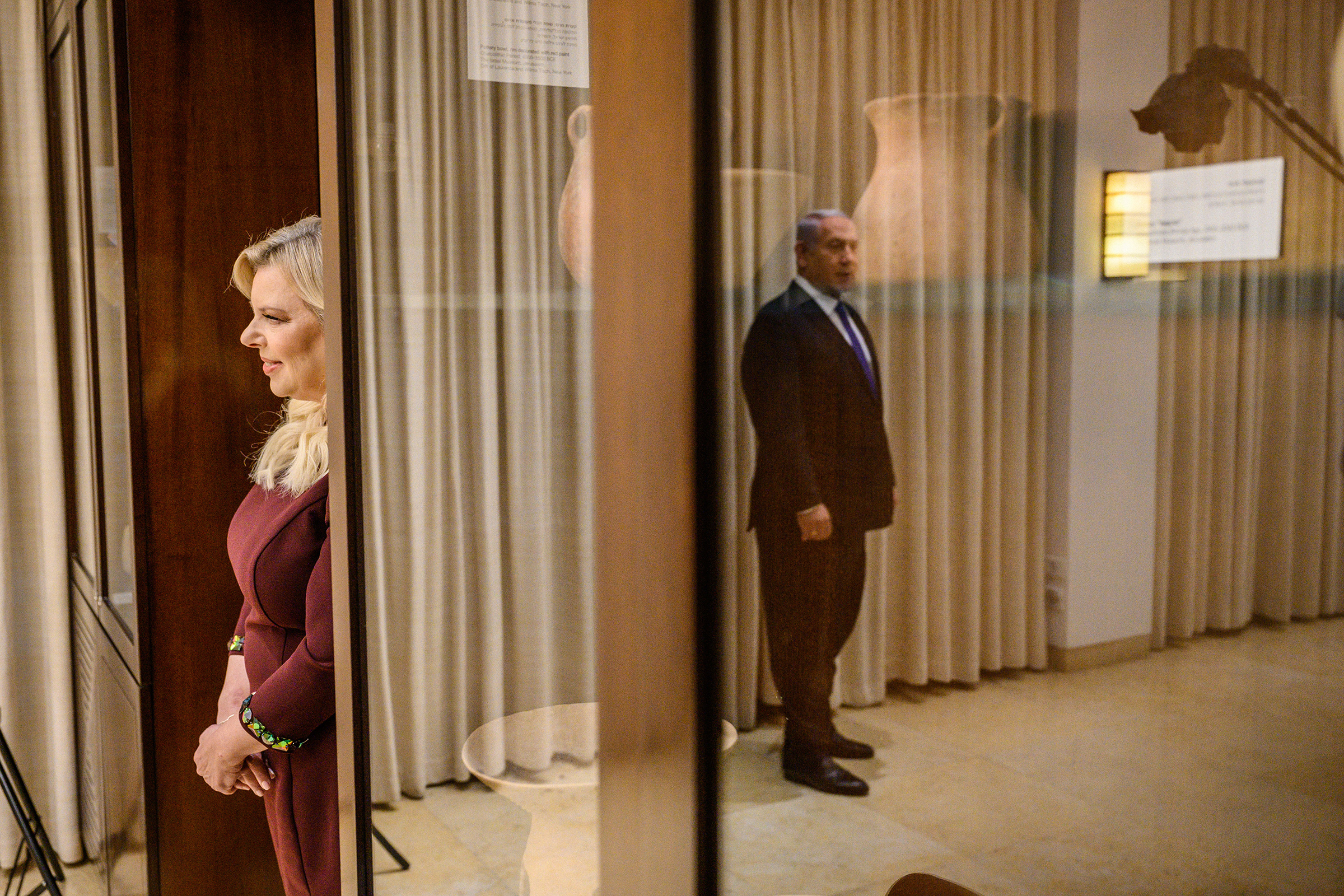 Sara Netanyahu looks on as the Prime Minister stands for a portrait in their residence in Jerusalem. (Yuri Kozyrev—NOOR for TIME)
