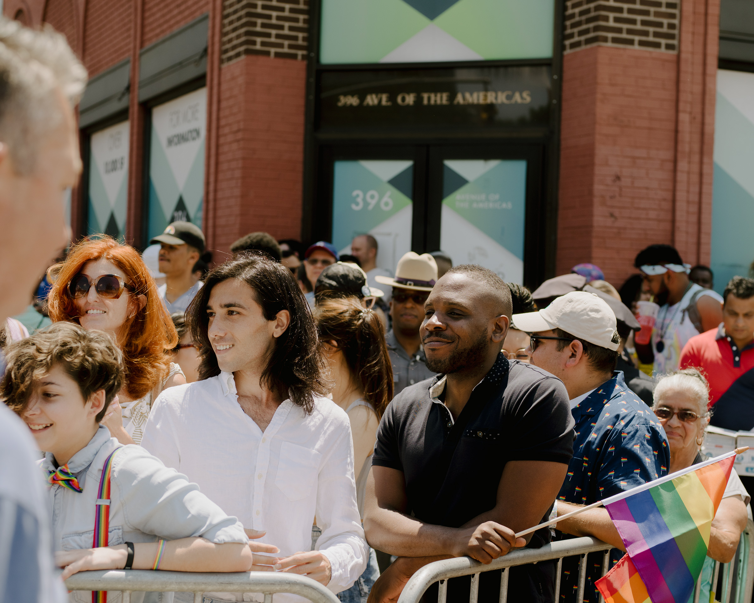 Amin Dzhabrailov and Kimahli Powell, executive director of the Rainbow Railroad organization, watch the Pride parade in New York on June 30, 2019. (Heather Sten for TIME)
