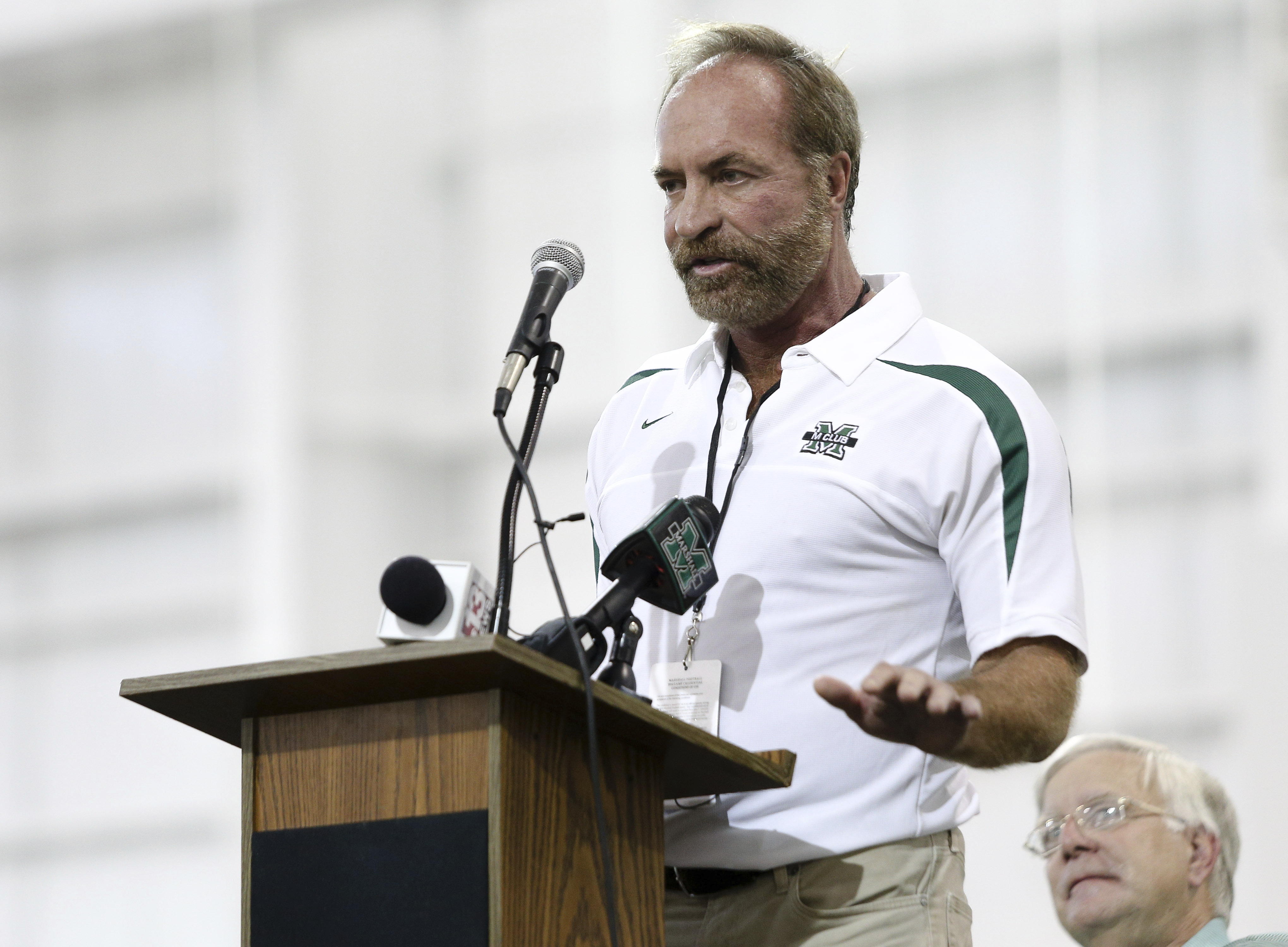 In this Sept. 6, 2014 photo, Chris Cline speaks as Marshall University dedicates the new indoor practice facility as the Chris Cline Athletic Complex in Huntington, W.Va. Police in the Bahamas say a helicopter flying from Big Grand Cay island to Fort Lauderdale has crashed, killing seven Americans on board.  None of the bodies recovered from the downed helicopter have been identified, but police Supt. Shanta Knowles told The Associated Press on Friday, July 5, 2019,  that the missing-aircraft report from Florida said billionaire Chris Cline was on board. (Sholten Singer/The Herald-Dispatch via AP) (Sholten Singer&mdash;AP)