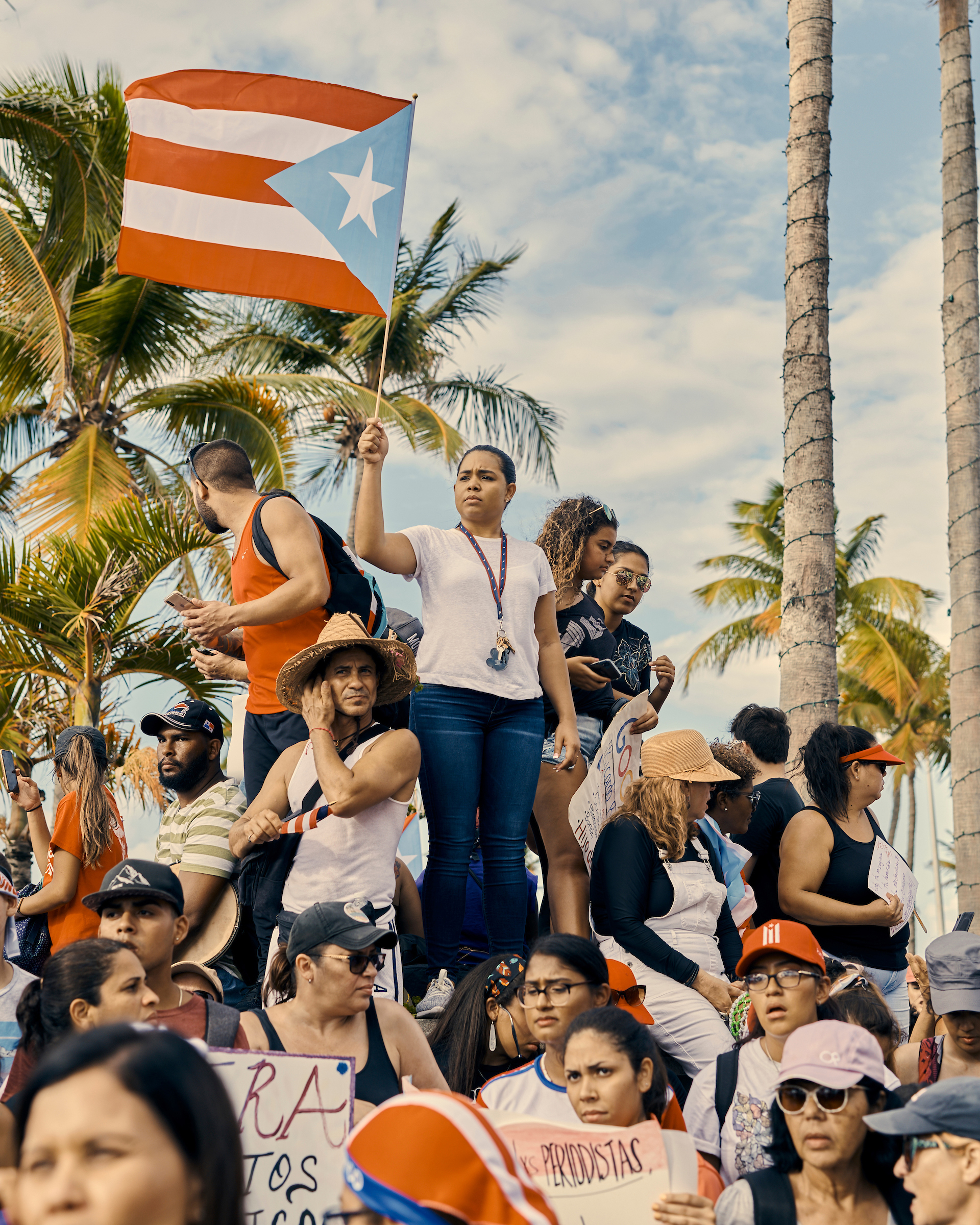 A woman waves a Puerto Rican flag at the anti-Rosselló protest in San Juan, Puerto Rico, on July 17, 2019.