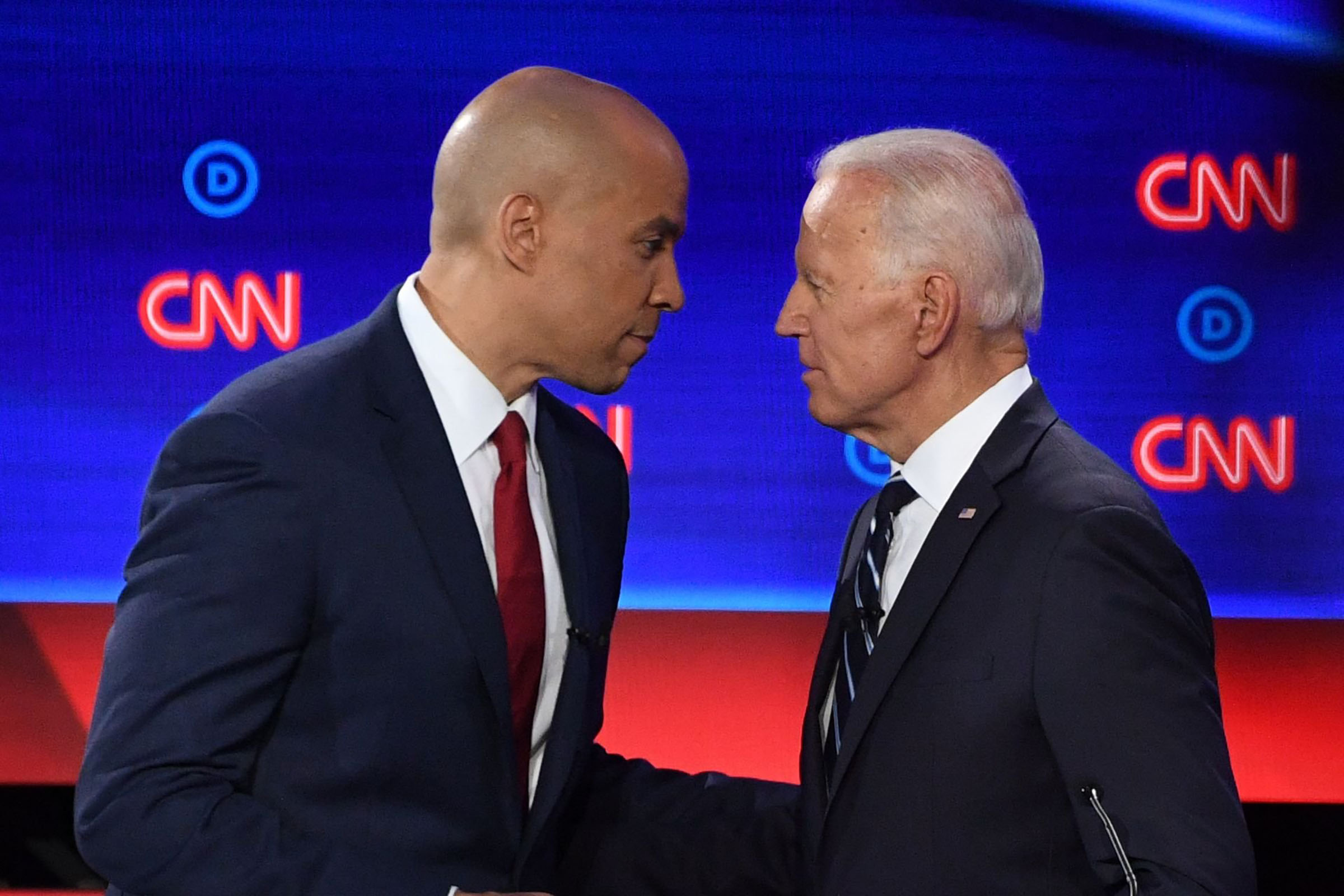 Democratic presidential hopefuls Former Vice President Joe Biden (R) and US Senator from New Jersey Cory Booker chat during a break in the second round of the second Democratic primary debate of the 2020 presidential campaign season hosted by CNN at the Fox Theatre in Detroit, Michigan on July 31, 2019. (Jim Watson—AFP/Getty Images)