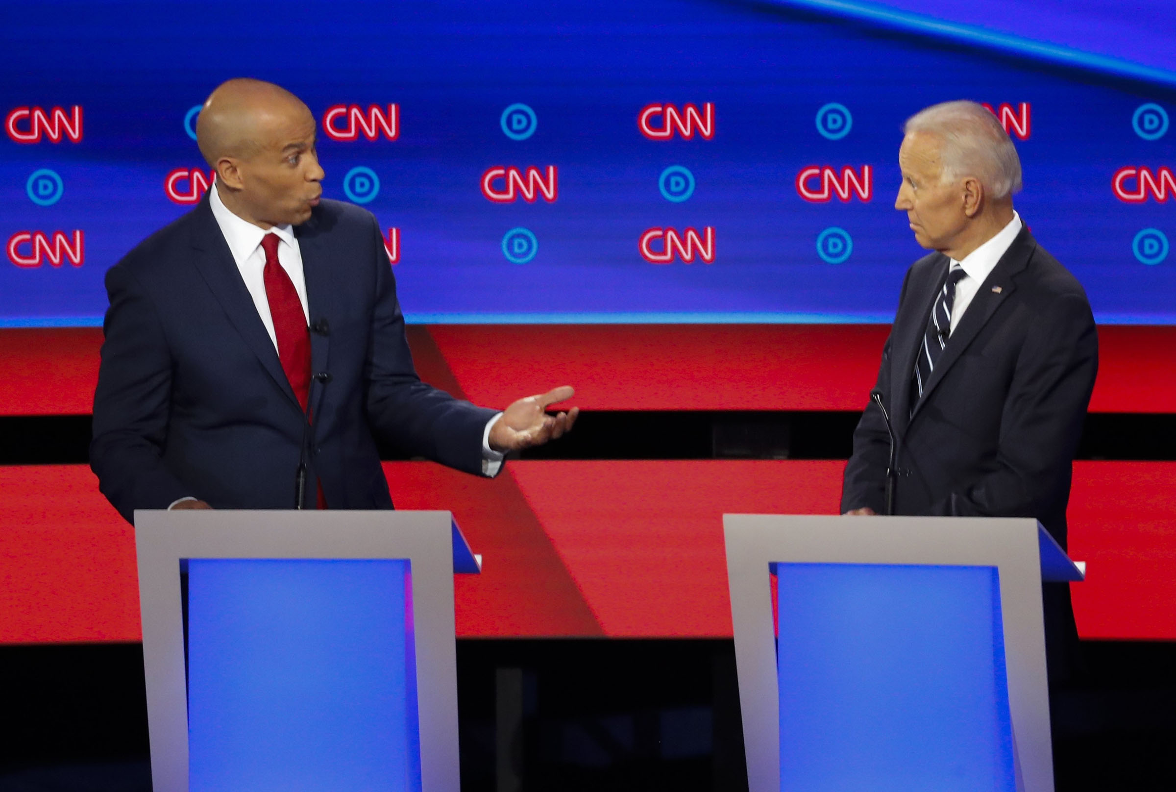 Sen. Cory Booker, D-N.J., speaks to former Vice President Joe Biden as they participate in the second of two Democratic presidential primary debates hosted by CNN Wednesday, July 31, 2019, in the Fox Theatre in Detroit. (Paul Sancya—AP)