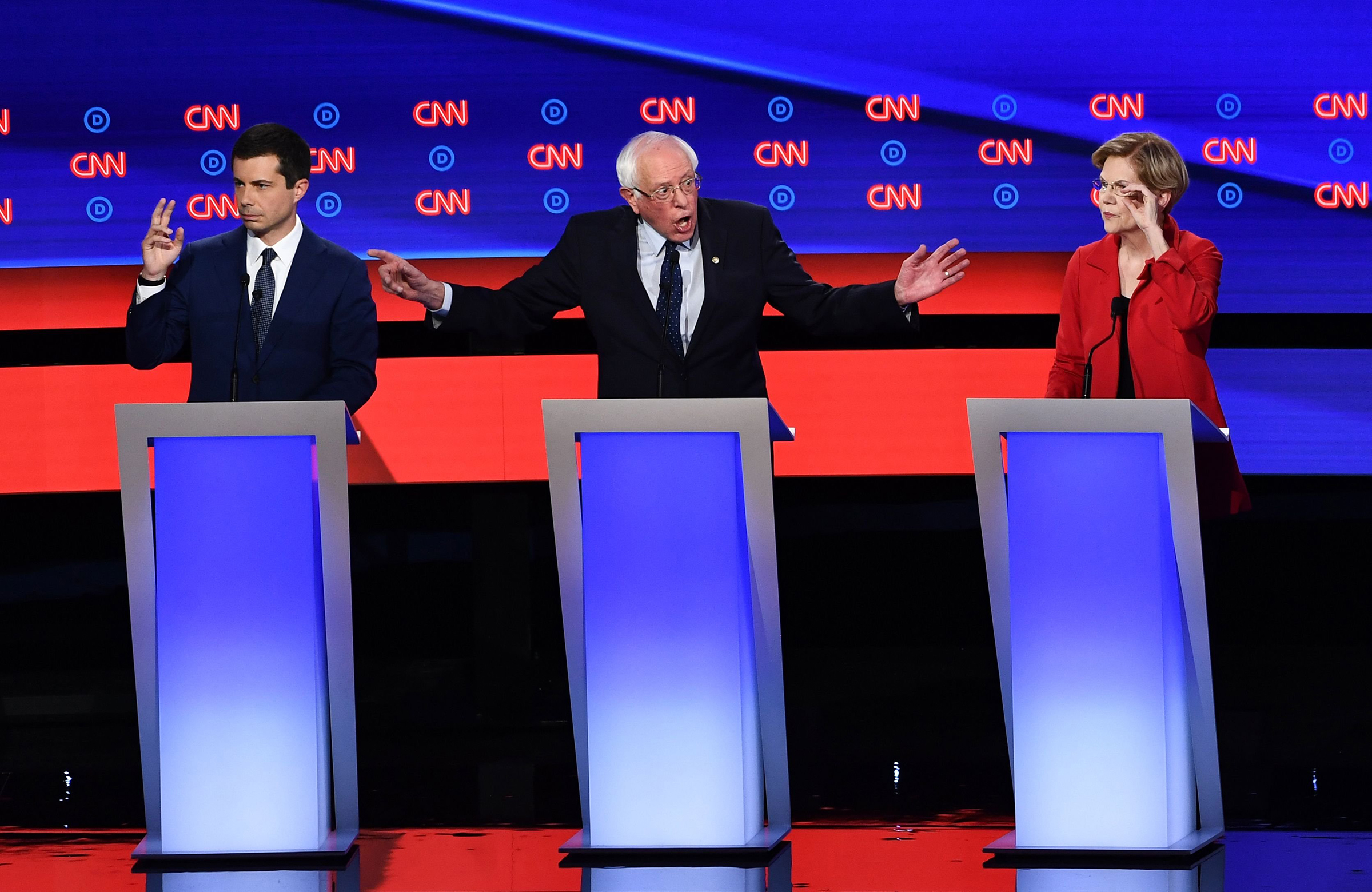 Democratic presidential hopefuls (L-R) Mayor of South Bend, Indiana, Pete Buttigieg, US senator from Vermont Bernie Sanders and US Senator from Massachusetts Elizabeth Warren participate in the first round of the second Democratic primary debate of the 2020 presidential campaign season hosted by CNN at the Fox Theatre in Detroit, Michigan on July 30, 2019. (Brendan Smialowski—AFP/Getty Images)