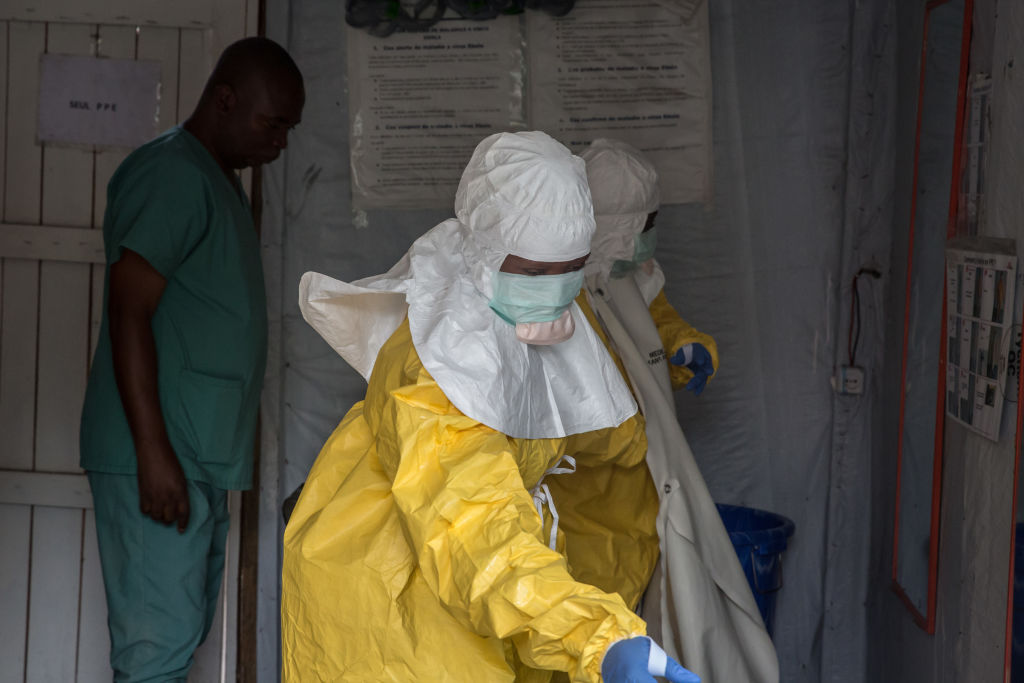 Medical staff dressed in protective gear before entering an