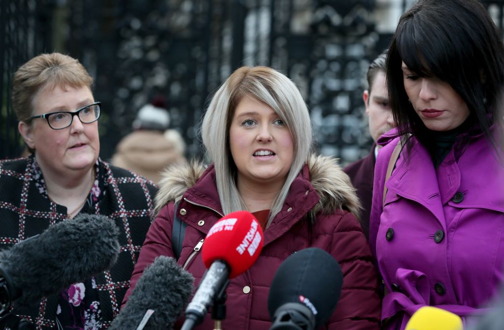 Northern Ireland resident and campaigner Sarah Ewart (C), who after having been diagnosed with a fatal foetal abnormality in 2013 travelled to England for a termination, with her mother stands with her mother Jane Christie (L) and Amnesty International's Grainne Teggart, as she speaks to members of the media after arriving at Belfast High court in Belfast, on January 30, 2019. (Paul Faith —AFP via Getty Images)