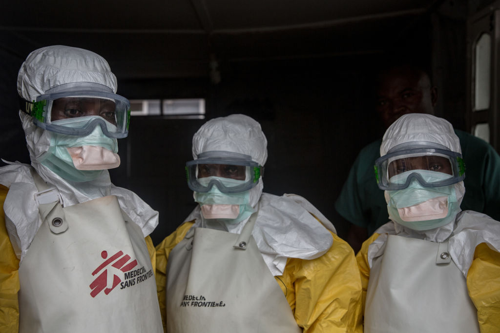 Medical staff dressed in protective gear before entering an isolation area at an Ebola treatment centre in Goma, DRC (Sally Hayden—SOPAImages/LightRocket via Getty Images)