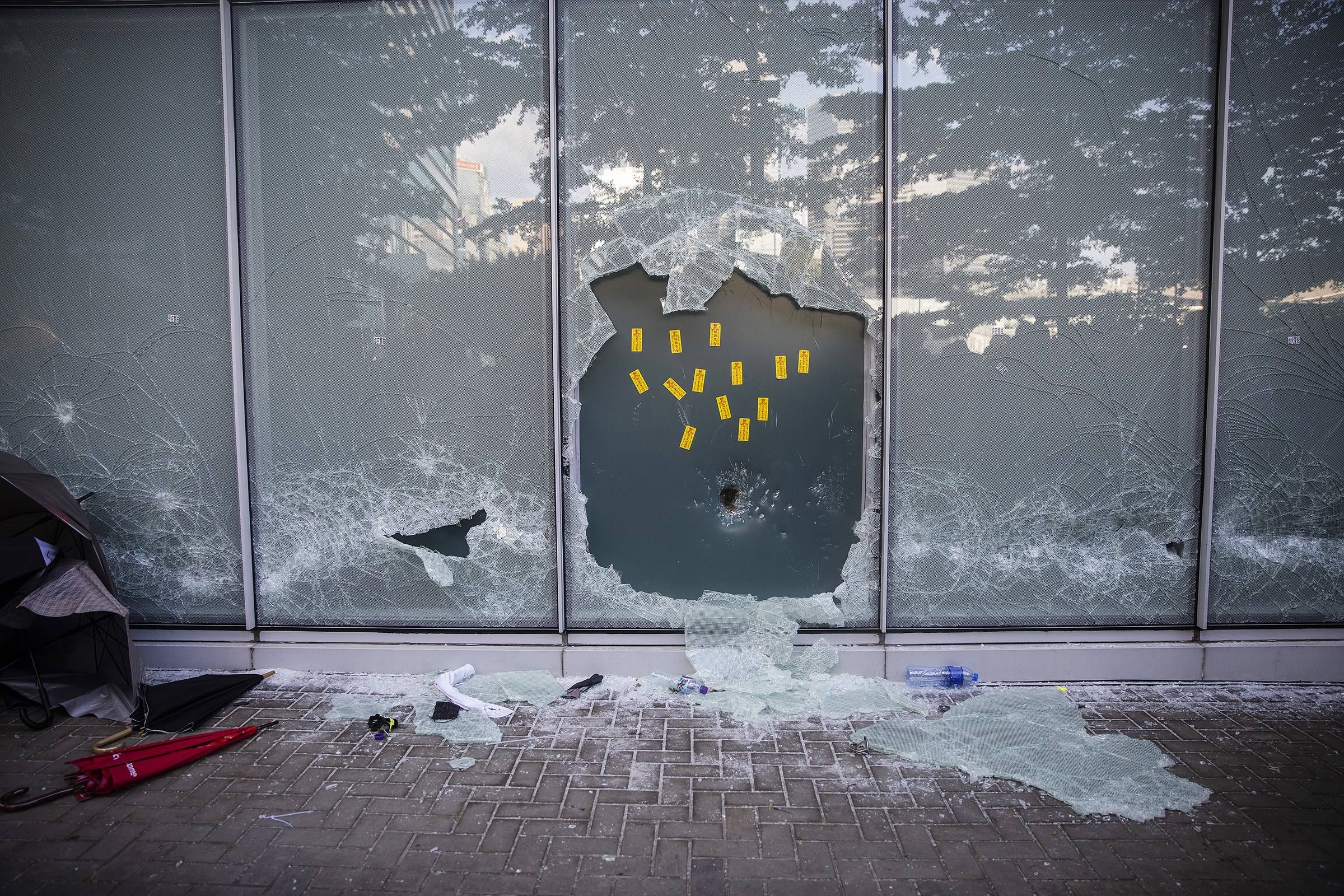 A broken window at the Legislative Council building during a protest in Hong Kong on July 1, 2019. (Justin Chin—Bloomberg/Getty Images)