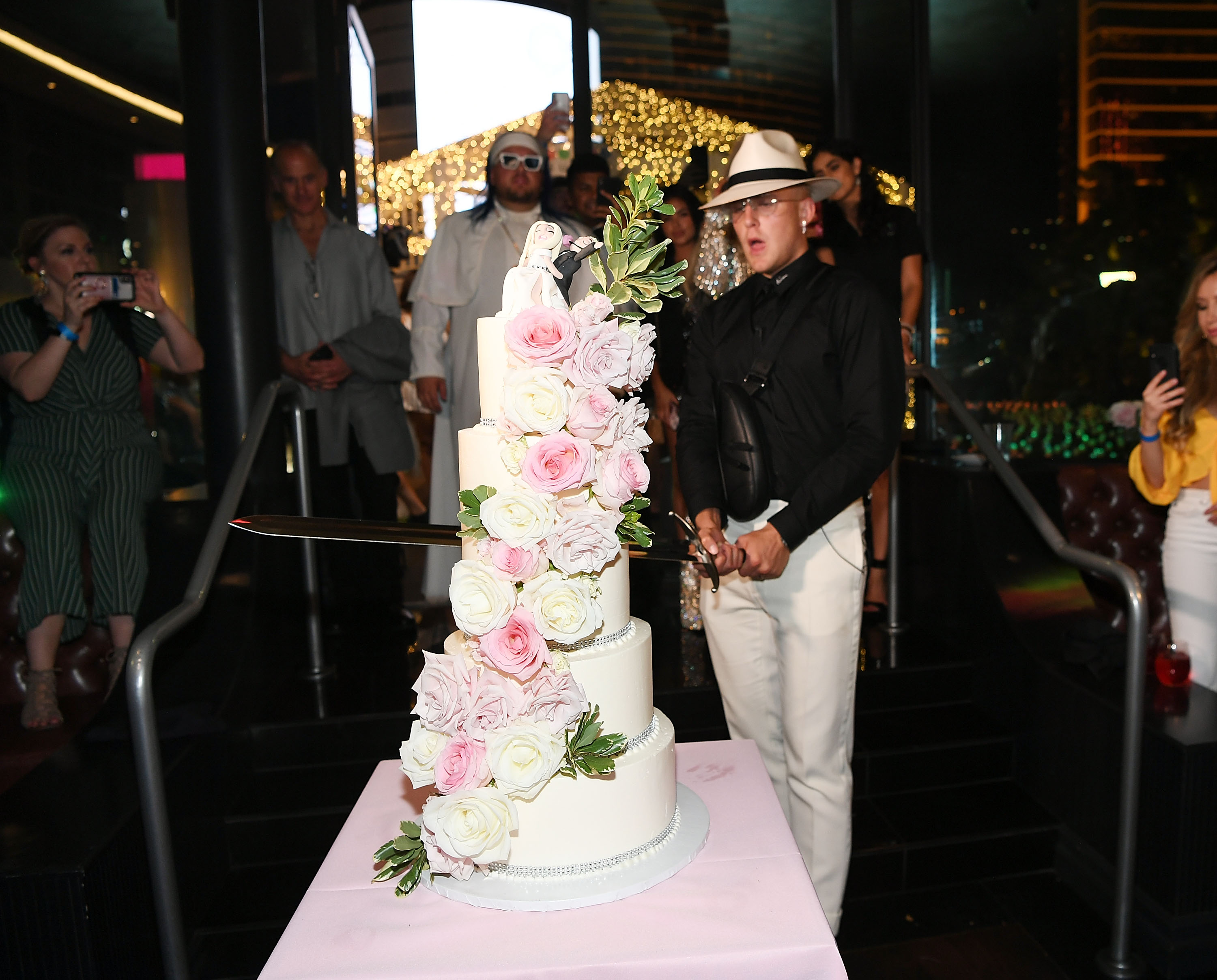 Jake Paul cuts the cake at his wedding reception at Sweet Beginnings in Sugar Factory on July 28, 2019 in Las Vegas, Nevada. (Photo by Denise Truscello/Getty Images for Sugar Factory) (Denise Truscello&mdash;Getty Images for Sugar Factory)