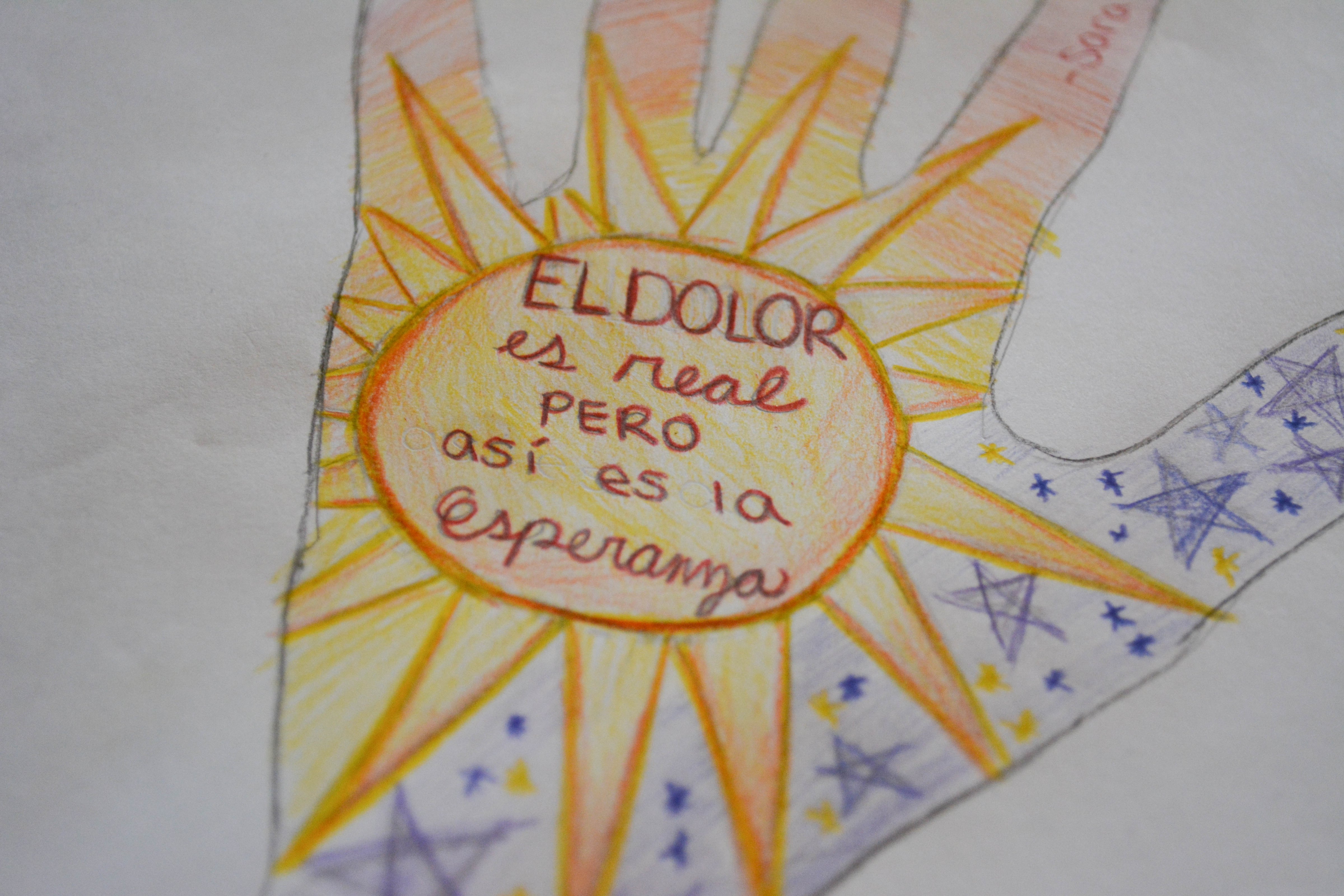 A drawing by a migrant woman in detention at the Otero County Prison in 2016 reads "Pain is real, but so is hope." Artist Haydee Alonso hosted an art workshop for migrant women. (Courtesy Edgar Picazo)