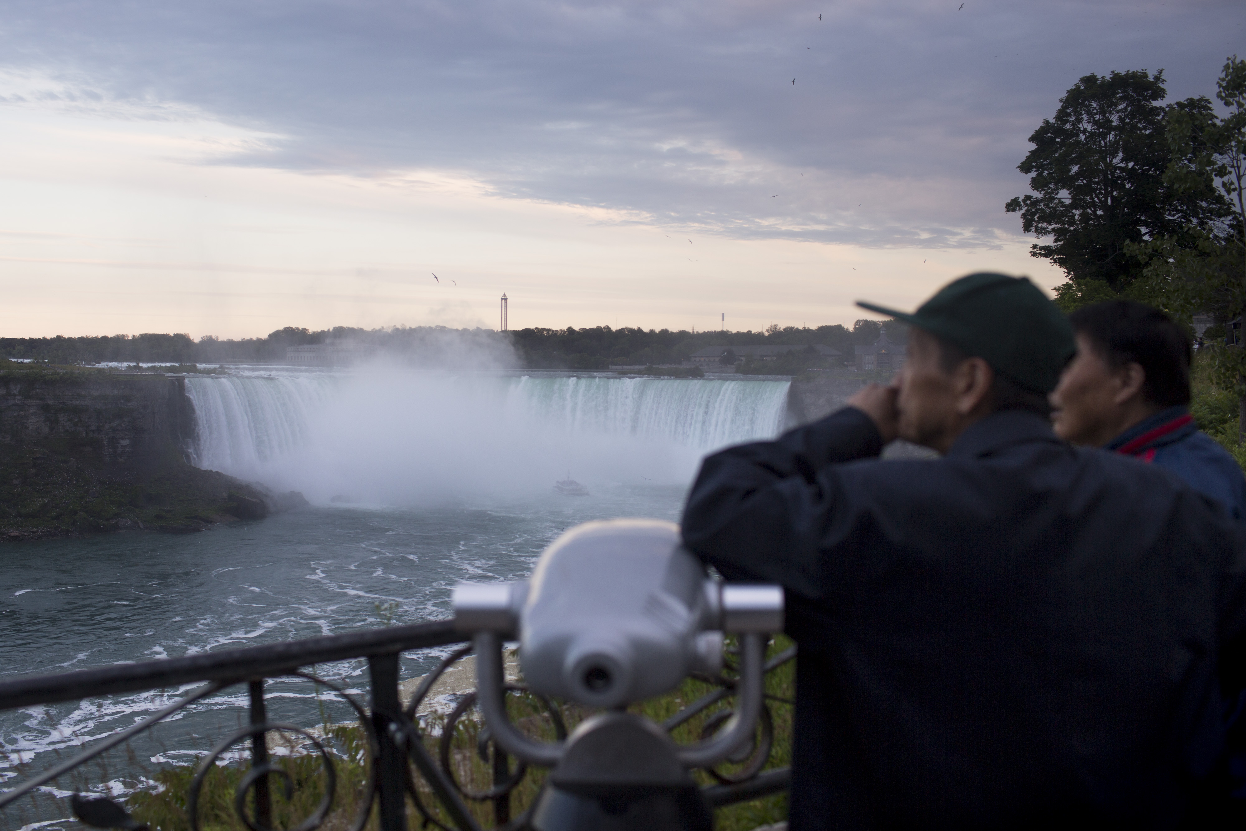 Tourists stand in front of the Horseshoe Falls in Niagara Falls, Ontario, Canada, on Wednesday, June 21, 2017. (Brent Lewin—Bloomberg/Getty Images)
