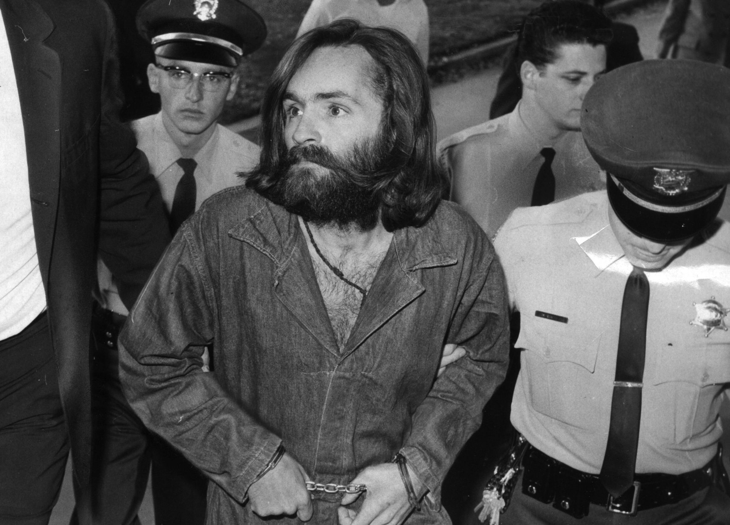 Charles Manson is escorted to court for a preliminary hearing on Dec. 3, 1969, in Los Angeles (John Malmin—Los Angeles Times via Getty Imag)