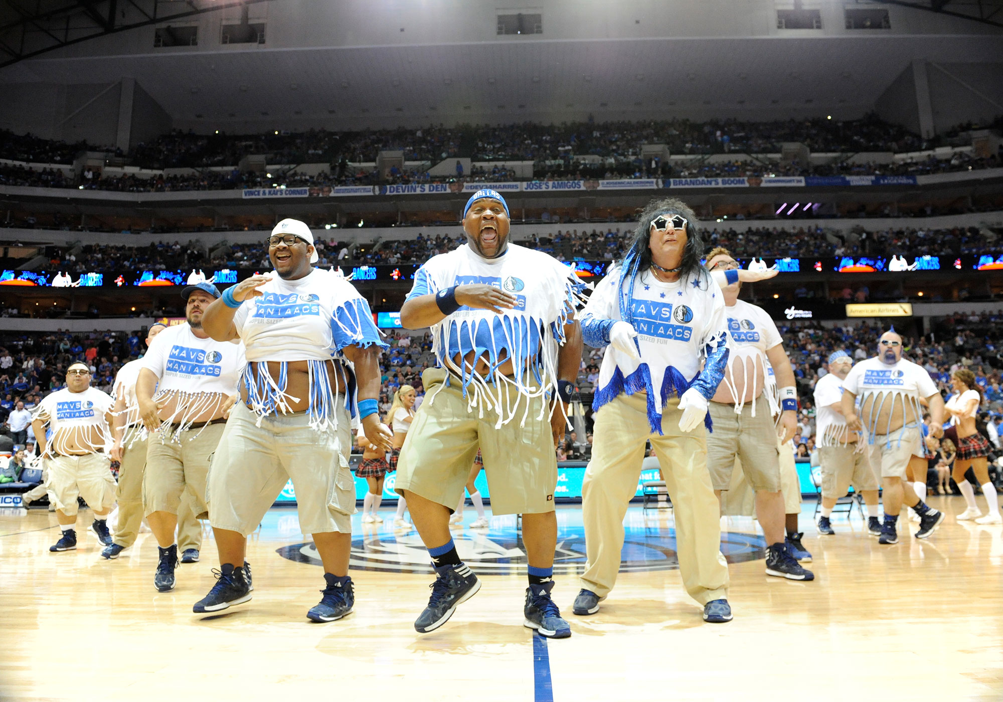 The Mavs ManiAACs perform during an NBA game between the Golden State Warriors and the Dallas Mavericks at the American Airlines Center in Dallas, TX on April 1, 2014. (Albert Pena—Icon SMI/Corbis via Getty Images)