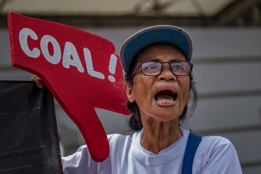 Environmental activists take part in a protest calling on the Group of 20 nations to end funding for coal and fossil fuels, in Manila, Philippines on June 26, 2019. (Ezra Acayan&mdash;Getty Images)