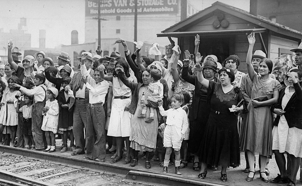 Relatives and friends wave goodbye to a train carrying 1,500 people being expelled from Los Angeles back to Mexico on Aug. 20, 1931. (New York Daily News Archive—NY Daily News via Getty Images)