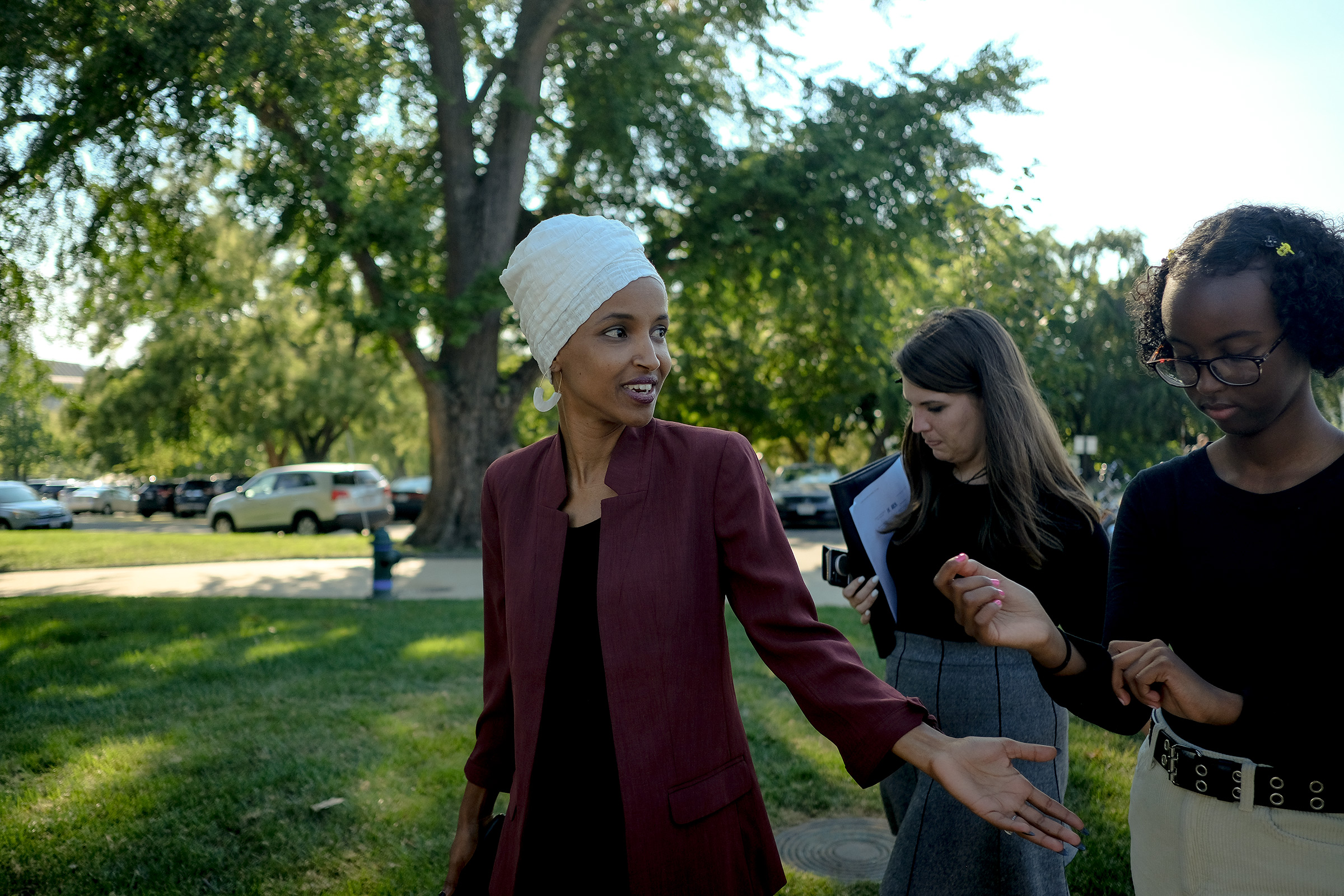 Omar on Capitol Hill with a staffer (center) and her daughter, Isra Hirsi (right), on July 15, 2019. (Gabriella Demczuk for TIME)