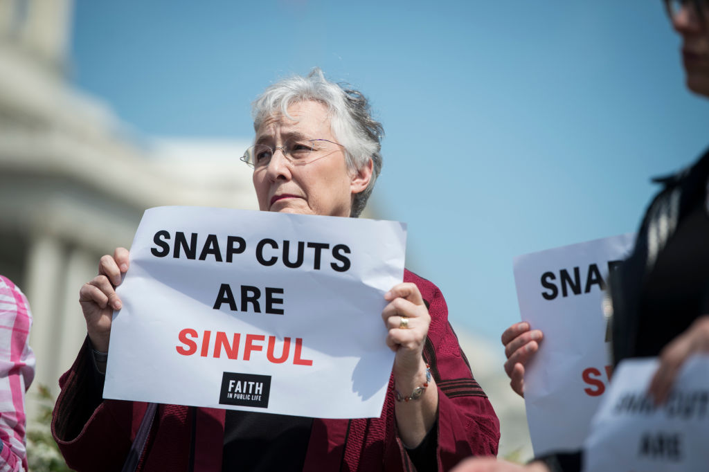 Demonstrators urge lawmakers to reject proposed cuts to the Supplemental Nutrition Assistance Program (SNAP) on May 7, 2018. (Sarah Silbiger—CQ Roll Call/Getty Images)