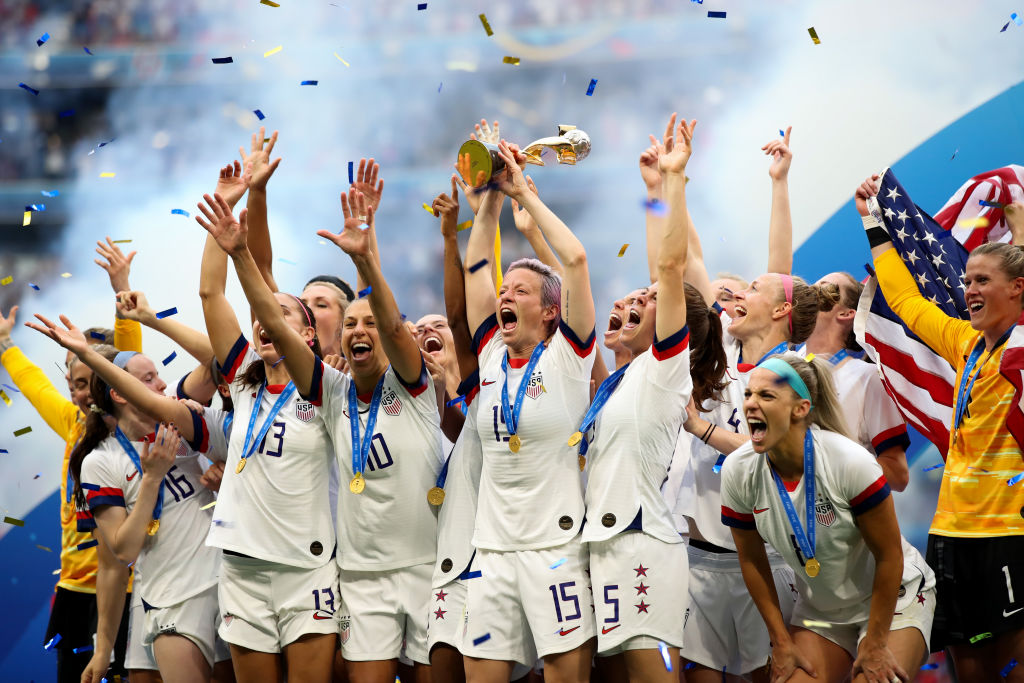USA players celebrate as they lift the trophy during the 2019 FIFA Women's World Cup France Final match between The United States of America and The Netherlands at Stade de Lyon on July 7, 2019 in Lyon, France. (Marc Atkins—Getty Images)