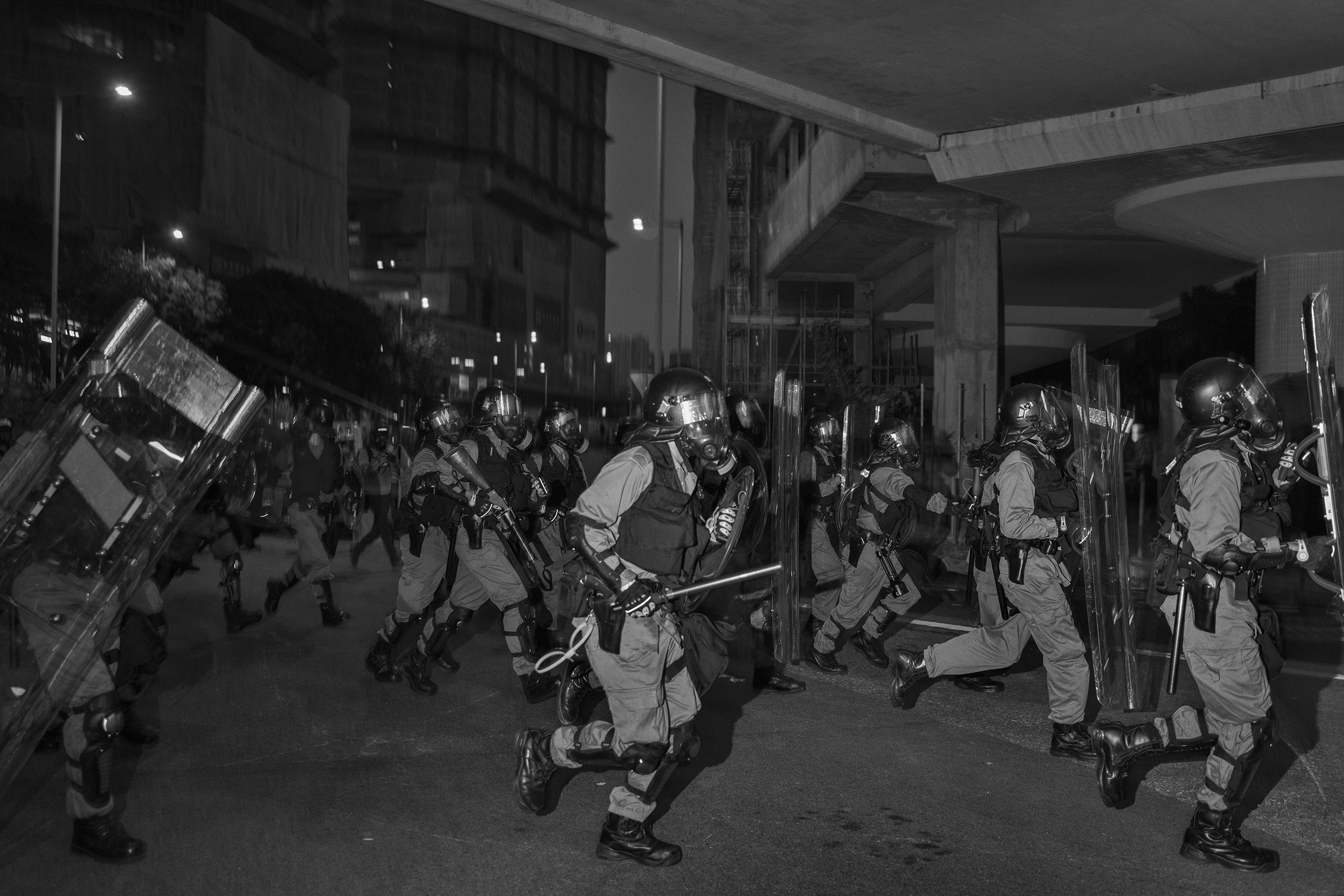 Riot police clear an unauthorized antigovernment protest near the Tai Wai train station on Aug. 10. (Adam Ferguson for TIME)