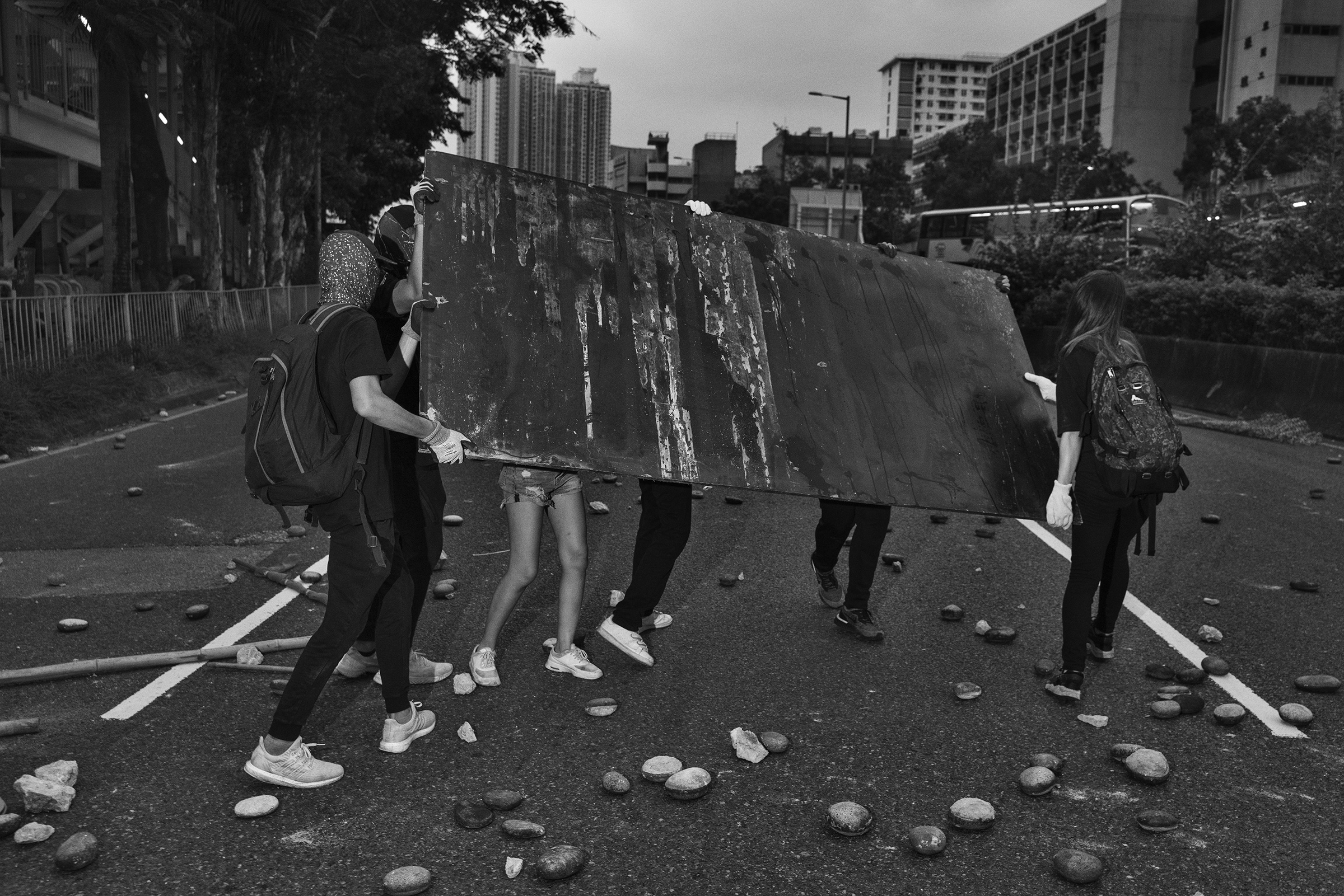 Antigovernment protesters block a road near the Tai Wai train station on Aug. 10. (Adam Ferguson for TIME)