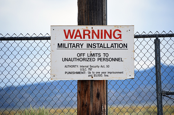 A warning sign is posted at the back gate of the top-secret military installation at the Nevada Test and Training Range known as Area 51 near Rachel, Nevada on July 22, 2019. (David Becker—Getty Images)