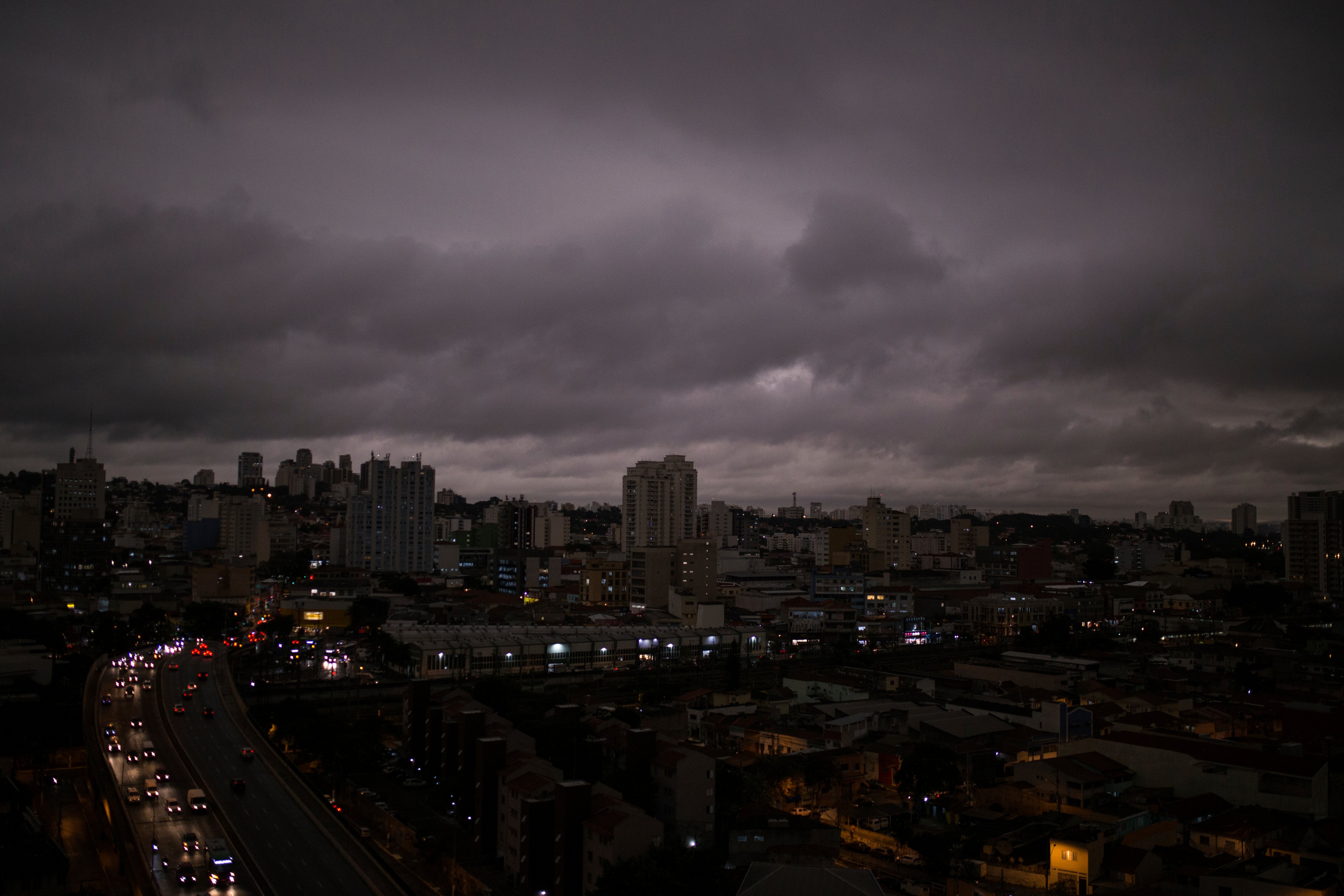 Darkened skies in Sao Paulo, seen on Monday, August 19. Residents of this metropolis of millions recently reported black rain. Studies by two universities confirmed that the rainwater contains fire residues. (Andre Lucas—AP Images)